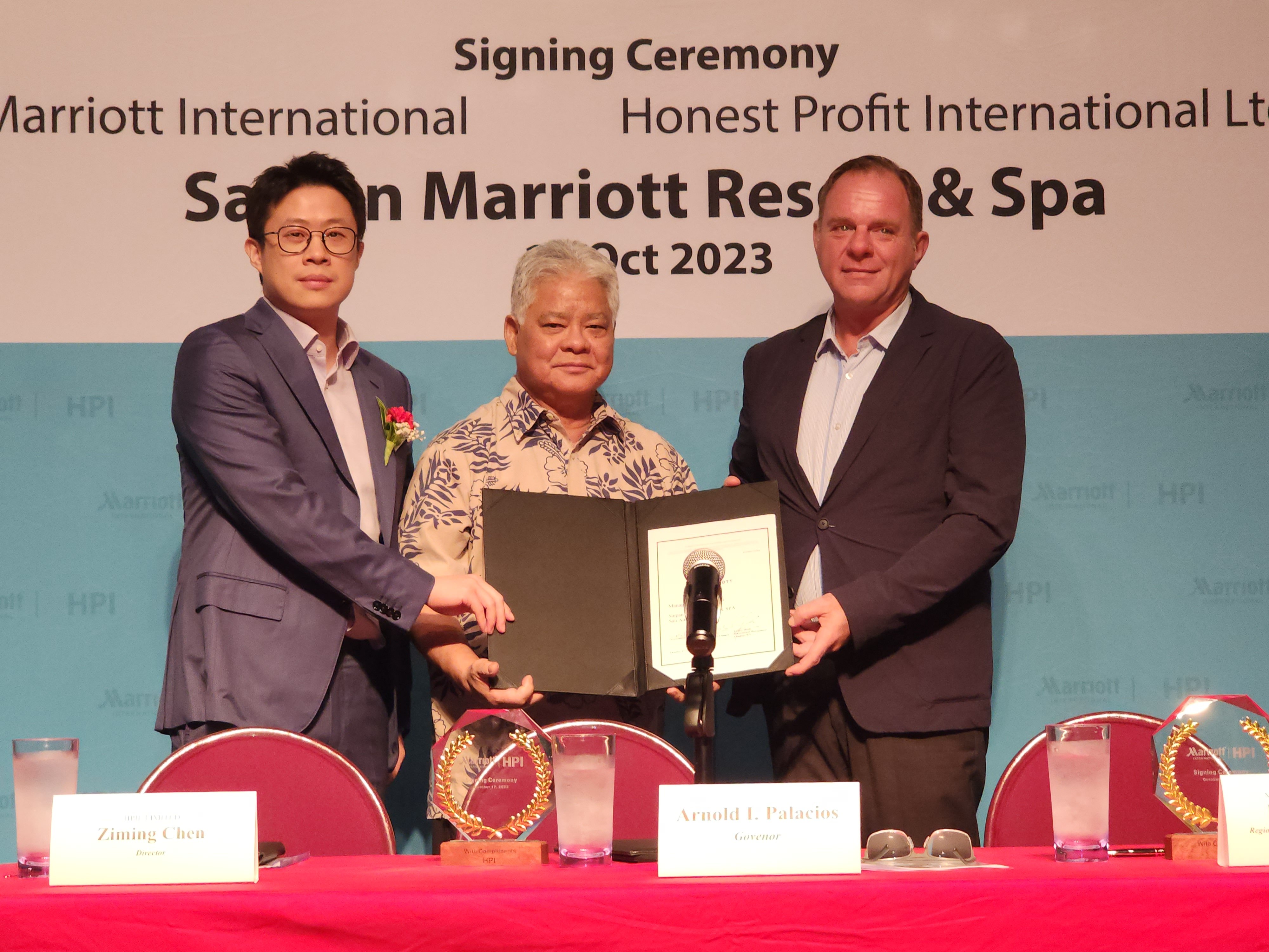 Gov. Arnold I. Palacios, center, poses for a photo with Honest Profit International Limited (Saipan) Director Ziming Chen, left, and Marriot International Regional Vice President for Hotel Development Peter Gassner after the signing of a hotel management agreement at the Hyatt Regency Saipan ballroom on Tuesday.
