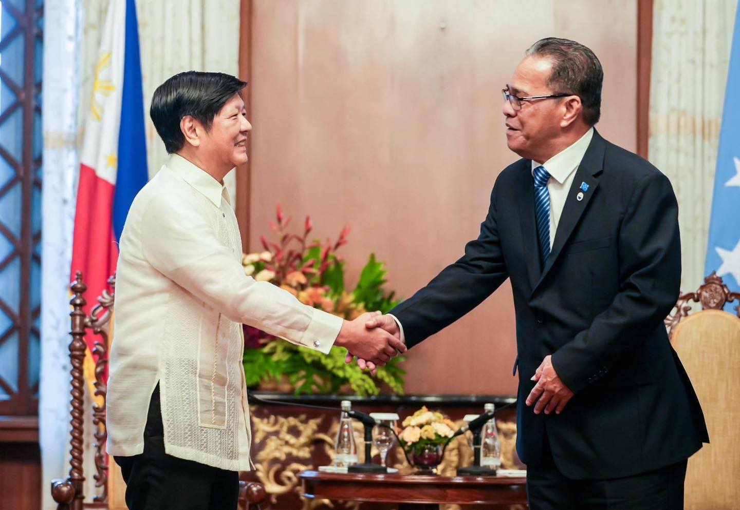 Federated States of Micronesia President Wesley W. Simina, right, and Philippine Ferdinand R. Marcos Jr. shake hands at the Malacañang Palace in Manila where they met on Friday, Oct. 13, 2023.