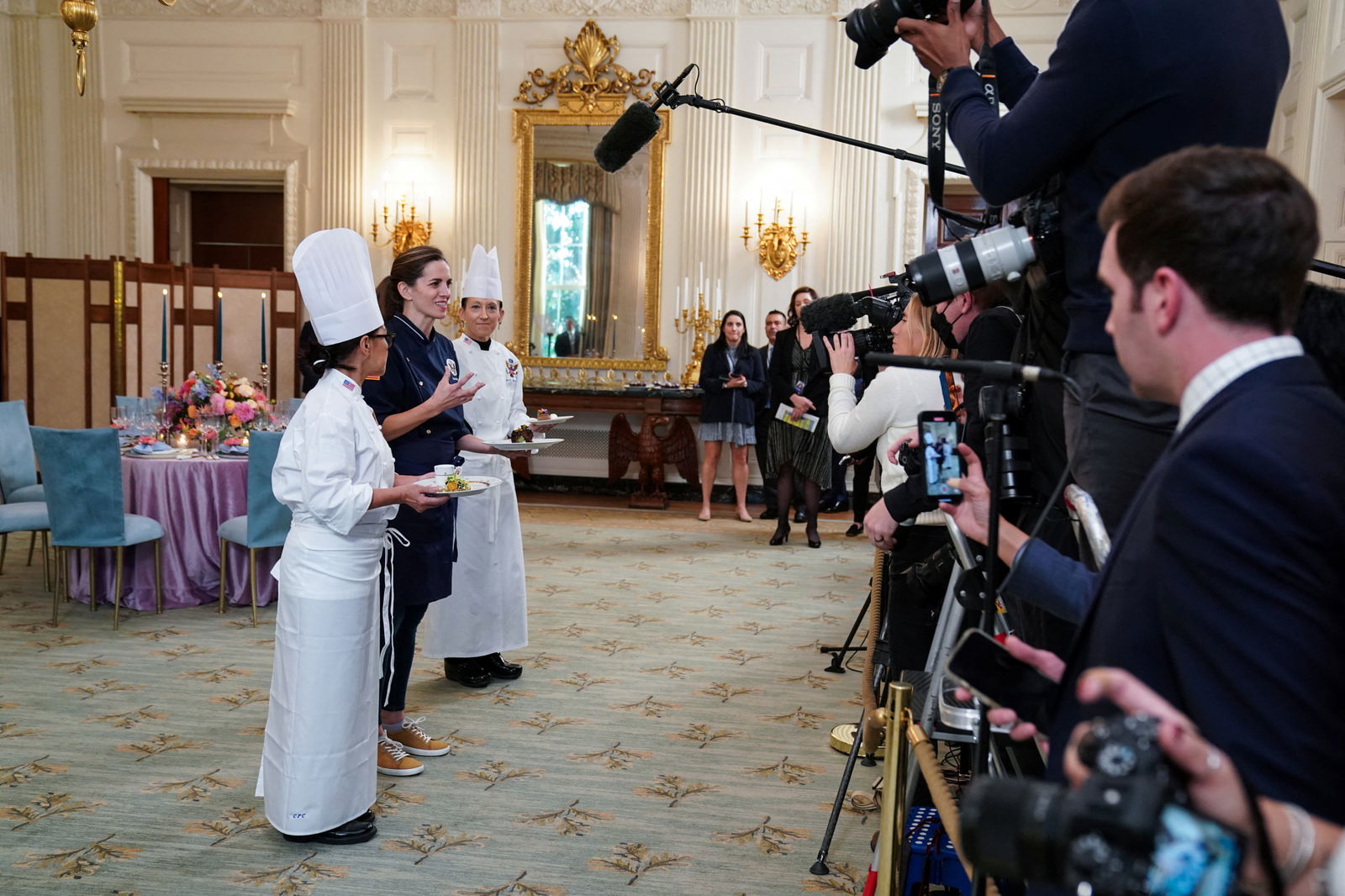Guest chef Katie Button and White House chefs preview the menu and place settings for the state dinner in honor of Australian Prime Minister Anthony Albanese in the State Dining Room at the White House in Washington, D.C., U.S., October 24, 2023. 