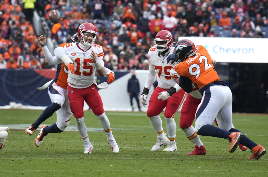 Kansas City Chiefs quarterback Patrick Mahomes (15) fumbles as he is hit by Denver Broncos linebacker Baron Browning during the first half of an NFL game Sunday, Oct. 29, 2023 in Denver. The Broncos recovered the fumble.