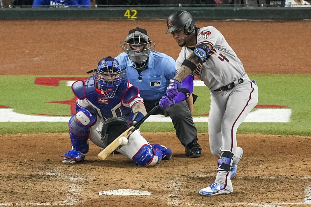 Arizona Diamondbacks’ Ketel Marte hits a two-run single against the Texas Rangers during the eighth inning in Game 2 of the World Series Saturday, Oct. 28, 2023 in Arlington, Texas.