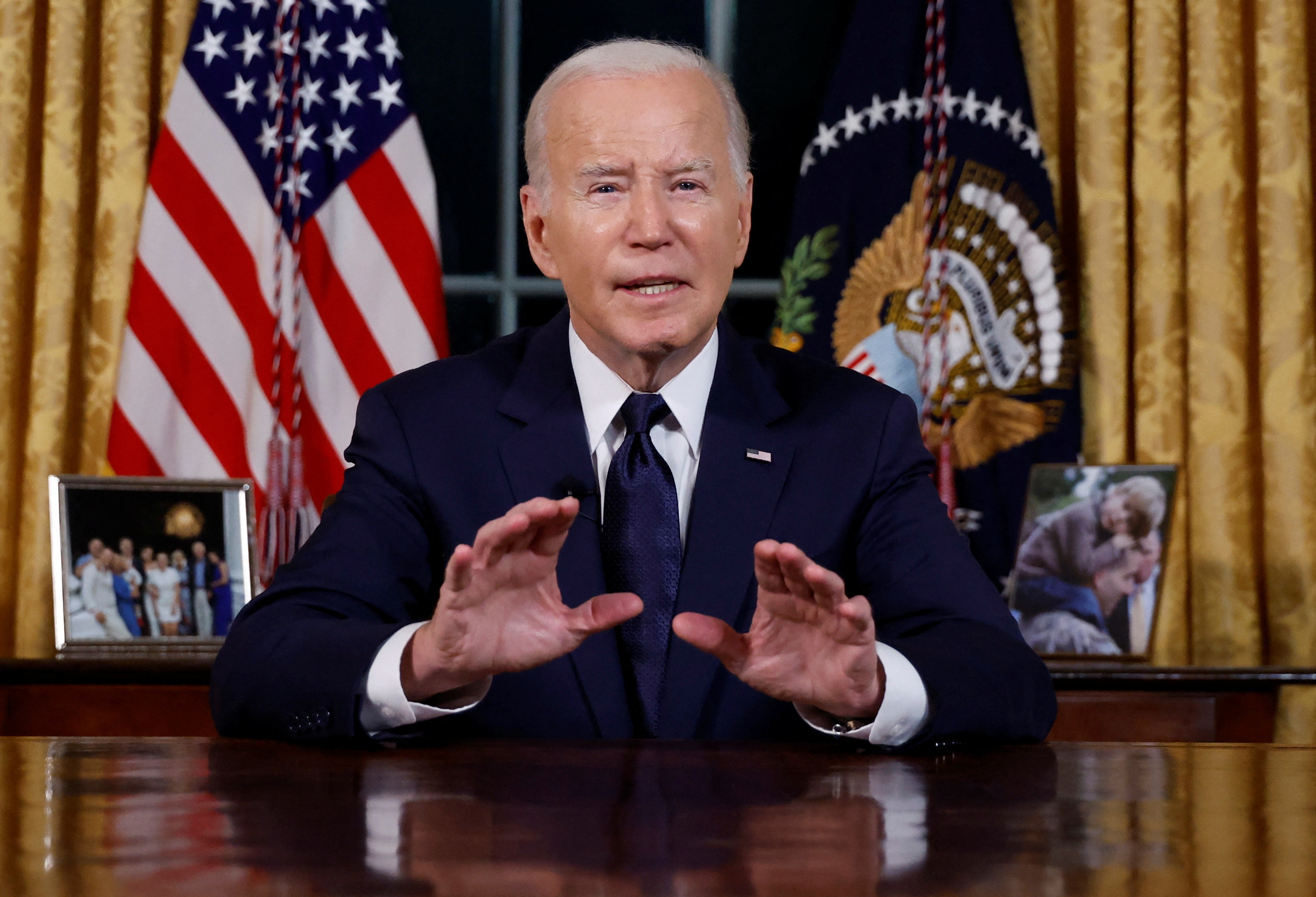 U.S. President Joe Biden delivers a prime-time address to the nation about his approaches to the conflict between Israel and Hamas, humanitarian assistance in Gaza and continued support for Ukraine in their war with Russia, from the Oval Office of the White House in Washington, U.S. October 19, 2023. 
