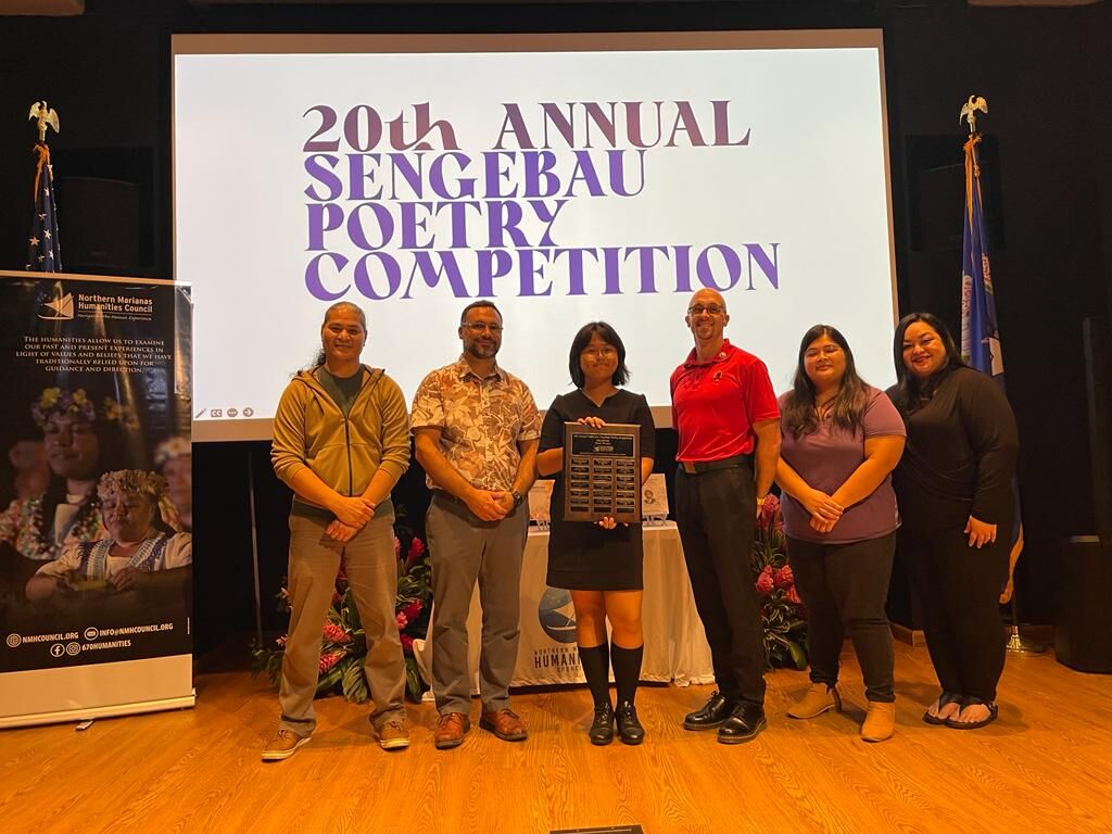 Saipan Southern High School's Yu Rong Jiang, center, won the 20th Sengebau Poetry Competition with her original poem, "Reminders of Home."