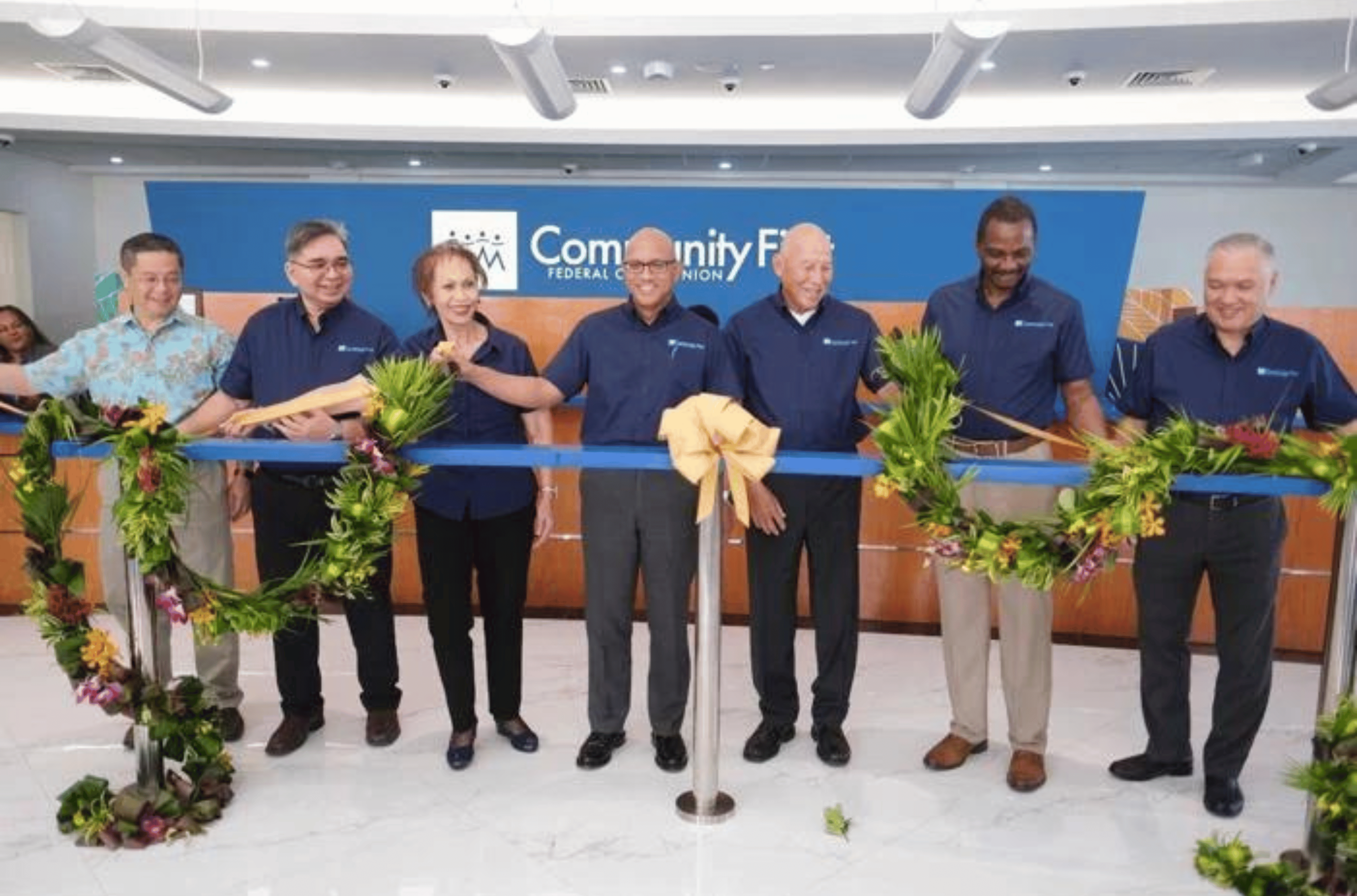 Gerry Cruz, center, president and CEO of Community First Guam Federal Credit Union, is joined by principals of the credit union during a ribbon-cutting ceremony for its new headquarters in Hagåtña on Saturday, Oct. 7, 2023.  