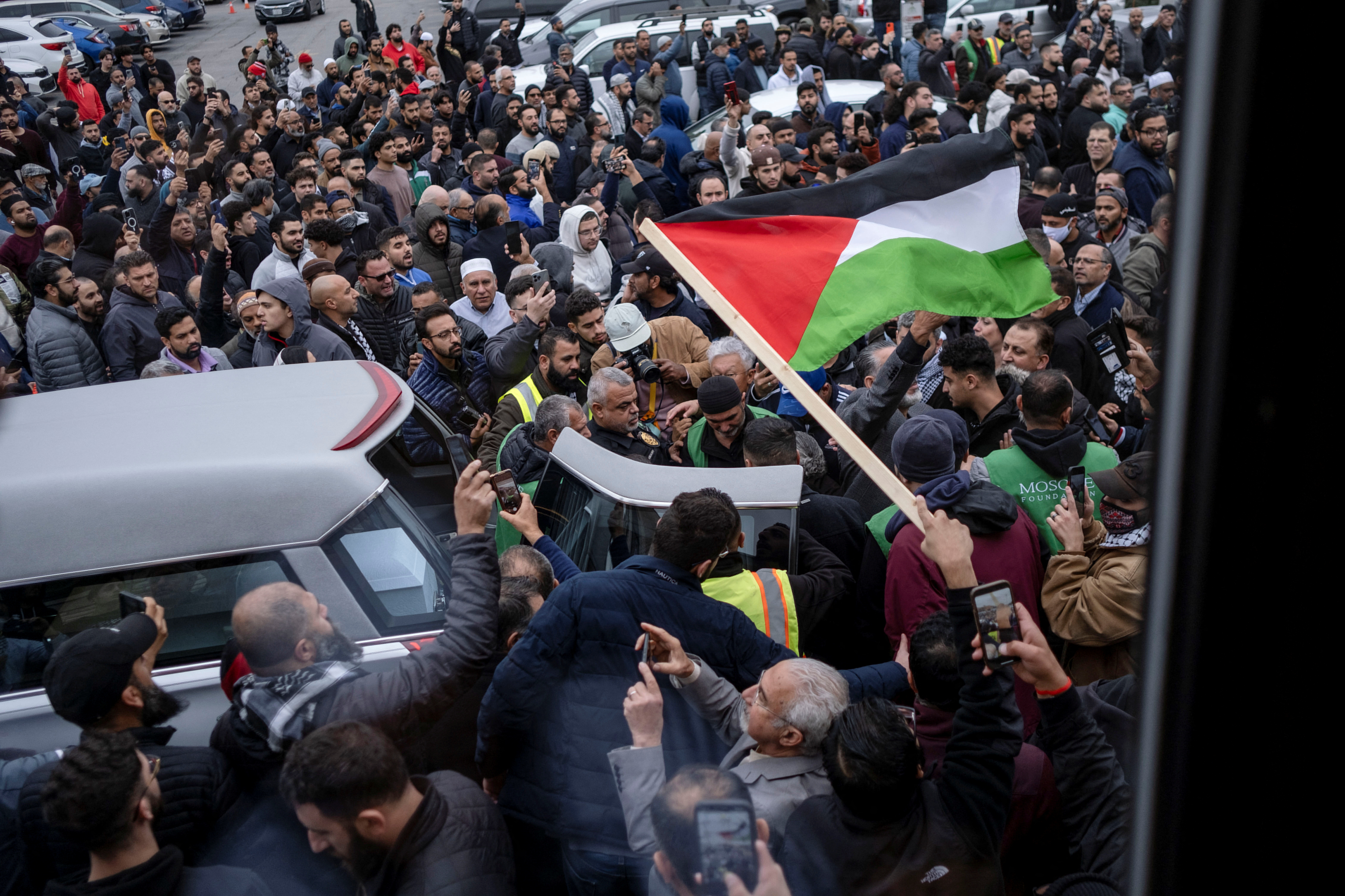 Mourners surround the casket of Wadea Al-Fayoume being carried by his family out of Mosque Foundation where mourners attend a funeral prayer for Wadea Al-Fayoume, 6, a Muslim boy who according to police was stabbed to death in an attack that targeted him and his mother for their religion and as a response to the conflict between Israel and Hamas, in Bridgeview, Illinois, U.S. October 16, 2023. 