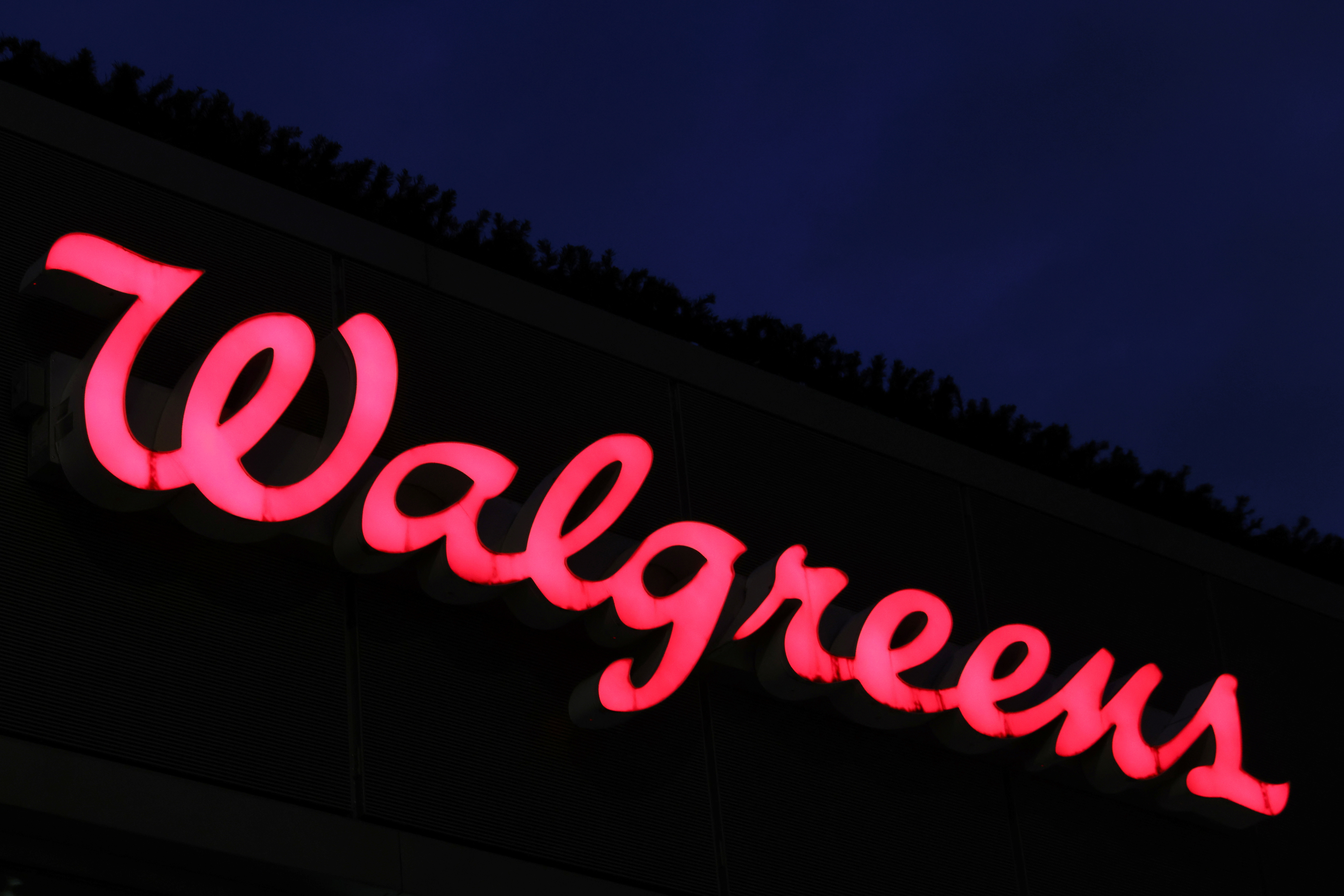 Signage is seen outside of a Walgreens, owned by the Walgreens Boots Alliance, Inc., in Manhattan, New York City, U.S., November 26, 2021. 