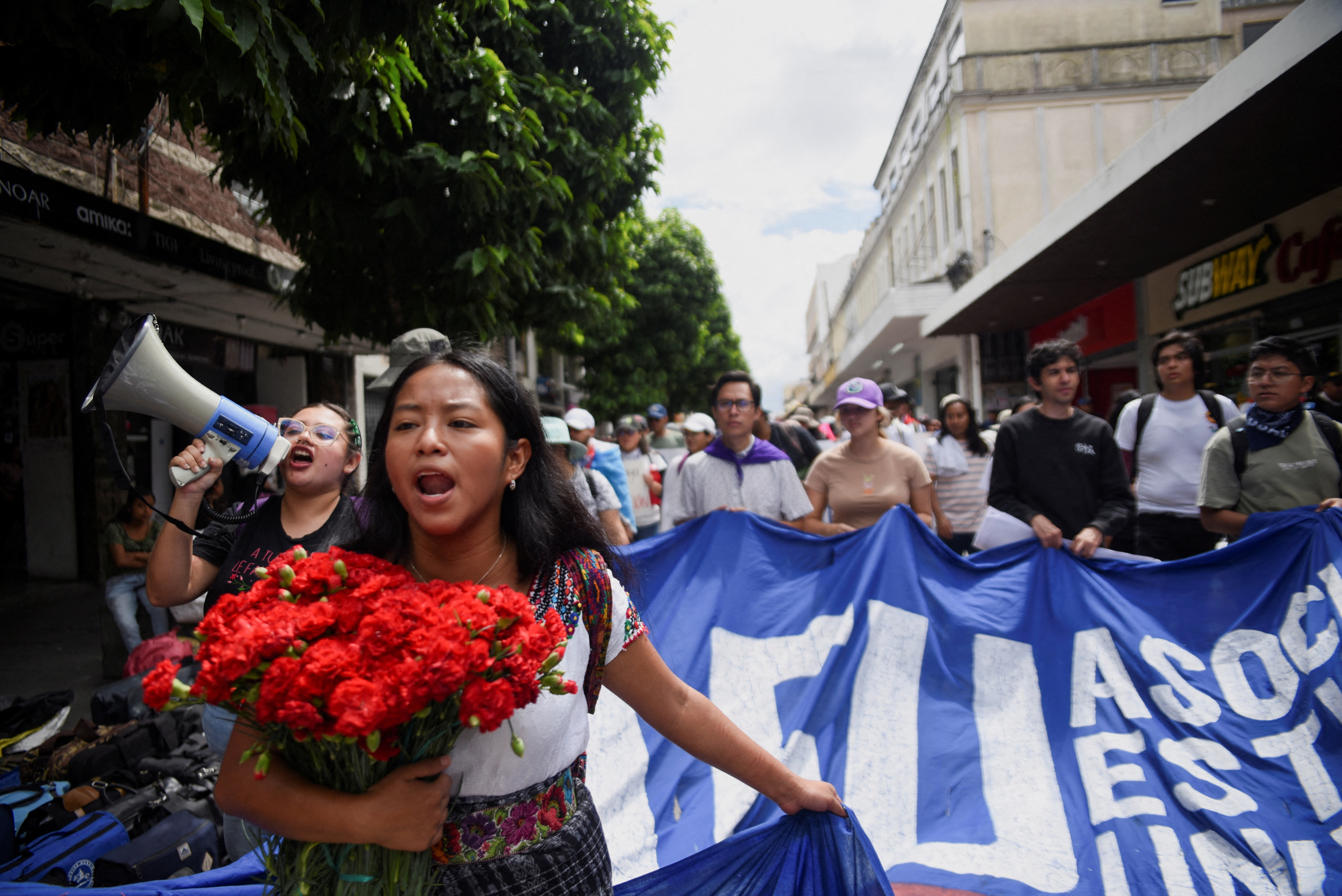 People take part in a march in support of democracy as the attorney general's office has intensified investigations into the election and President-elect Bernardo Arevalo's Seed Movement party, in Guatemala City, Guatemala October 20, 2023. 