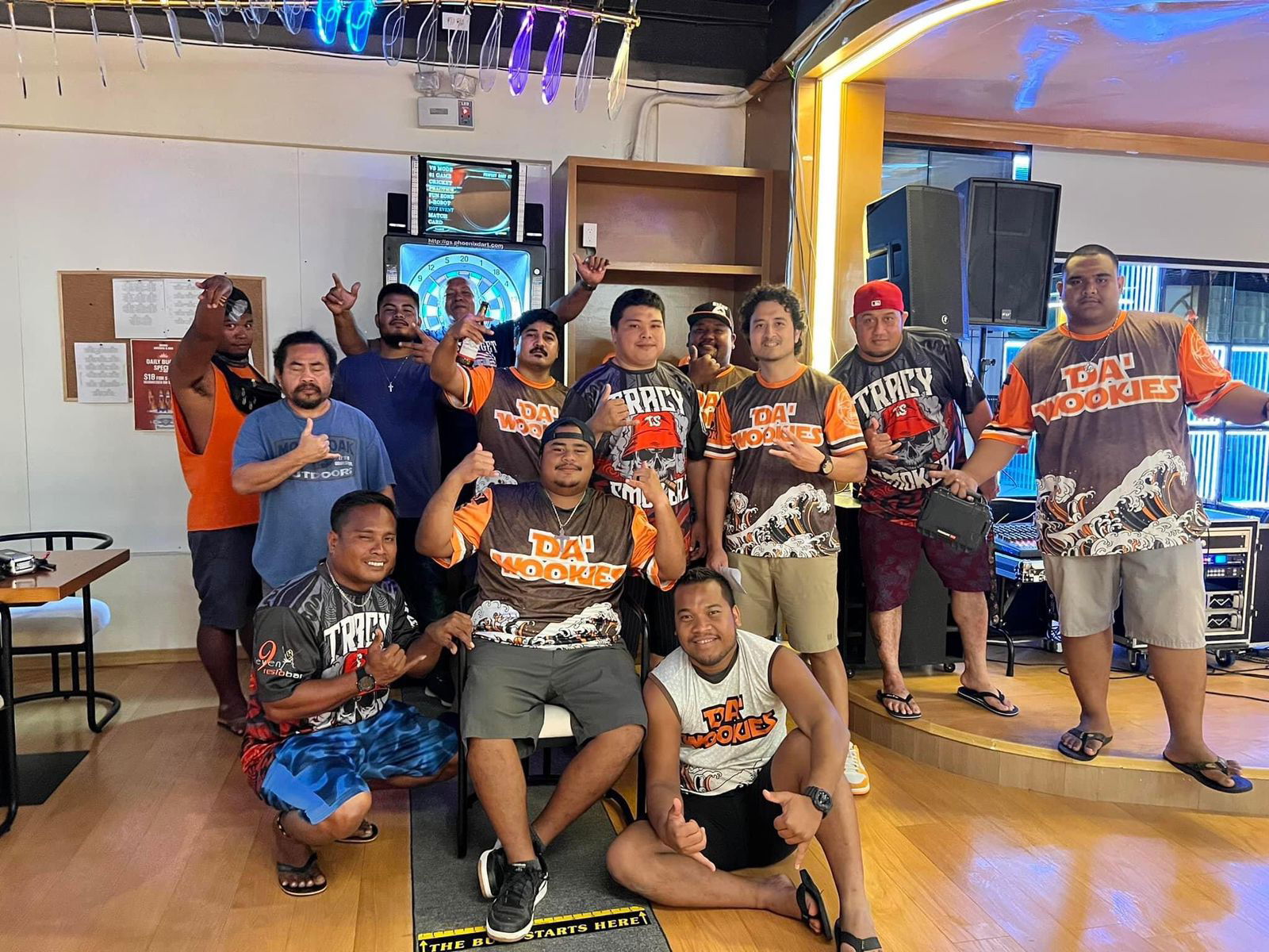 Bravo Da Wookies and the 9Eleven Tracy Smokers pose for a photo  after their Bud Light Cup game in the Thursday Flame Tree B Division of the 2023 SEDA Bud Light Dart League at Bravo Kitchen & Bar.