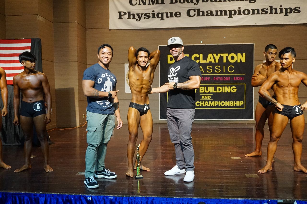 Davy Laxa poses for a photo after winning second place in the short class of the men's physique category of the 2023 Dee Clayton Classic & Northern Marianas Bodybuilding Federation at the Saipan World Resort's Taga Hall in June 2023.