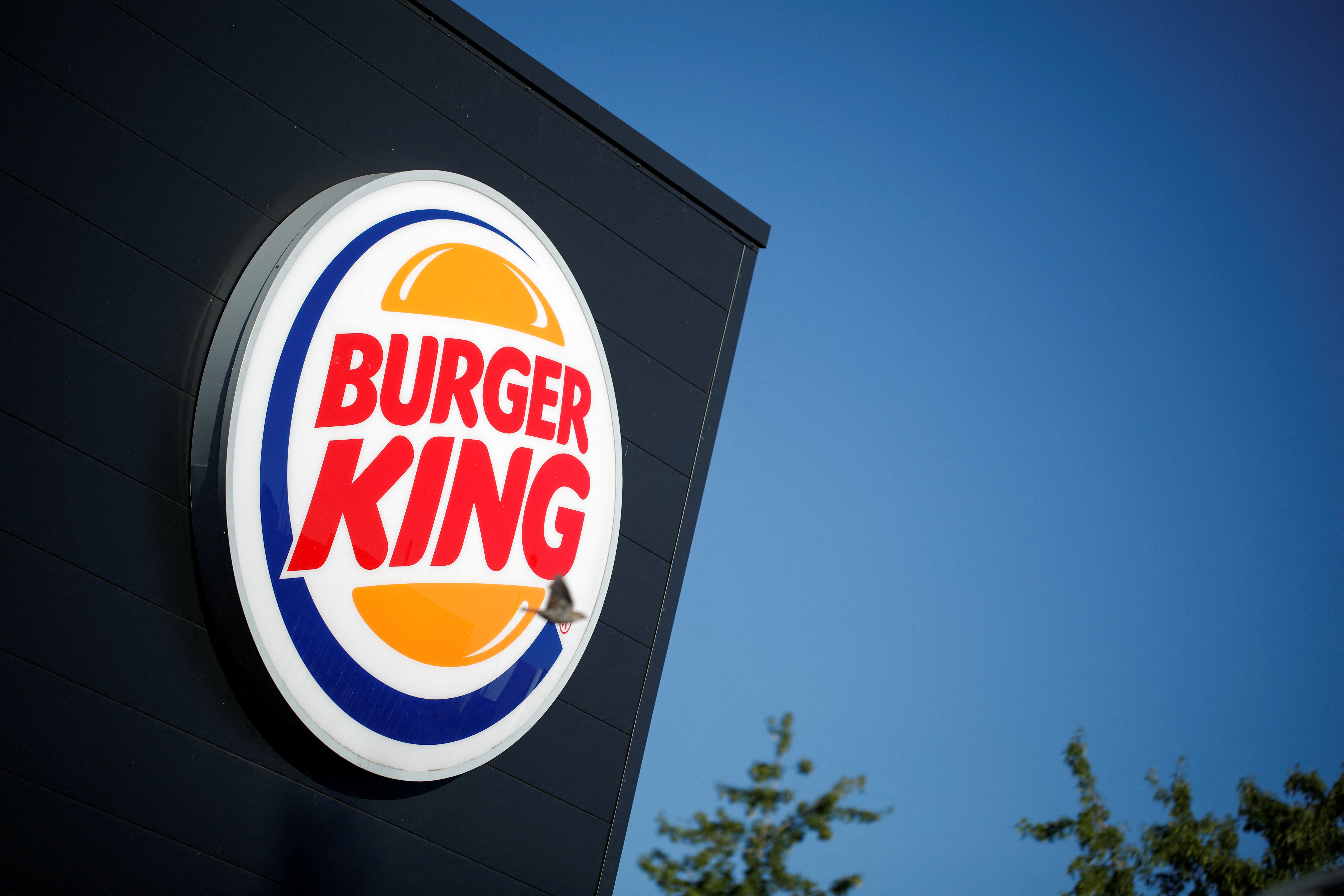 The Burger King company logo stands on a sign outside a restaurant in Bretigny-sur-Orge, near Paris, France, July 30, 2020. 