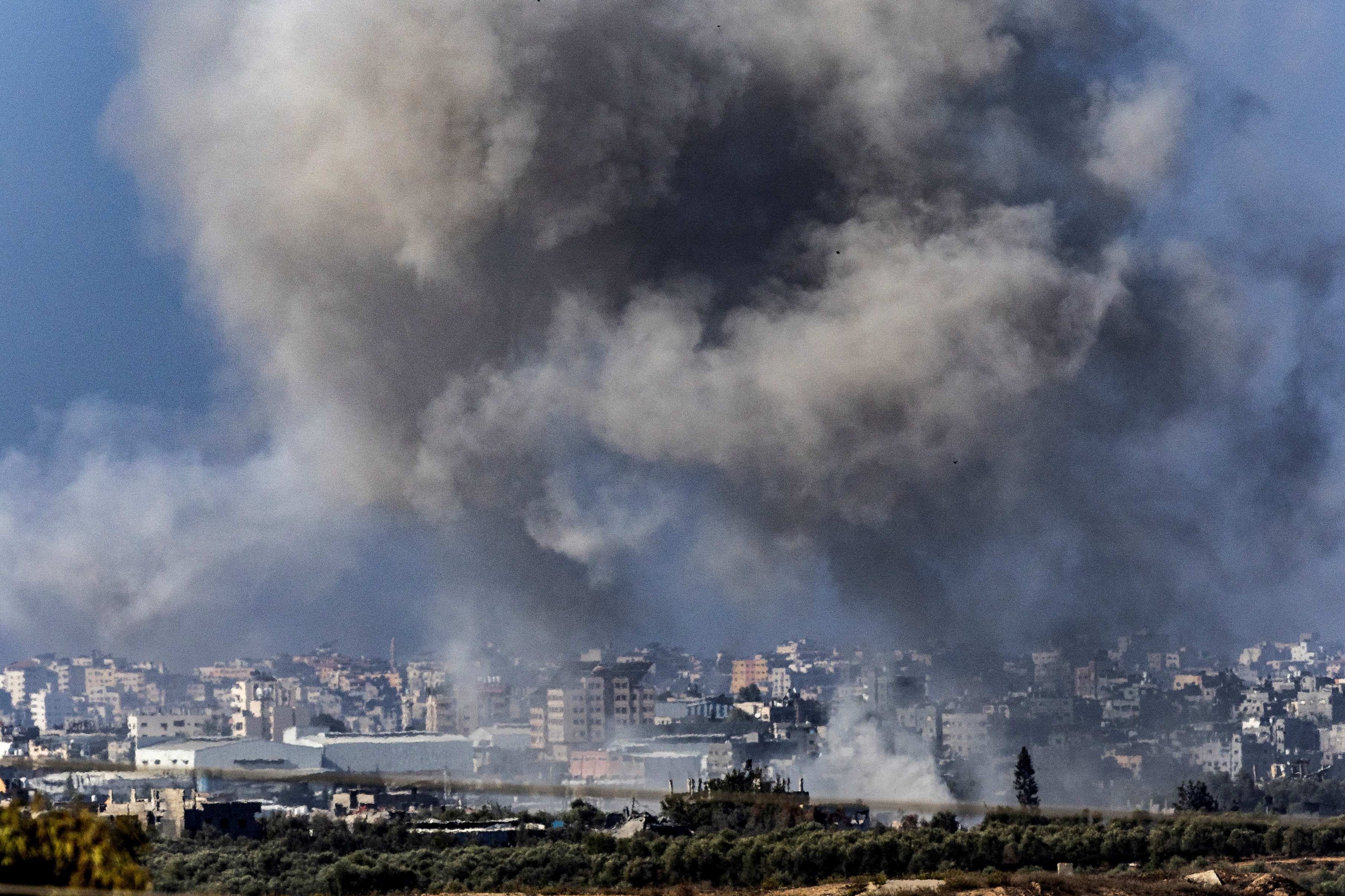 Smoke rises over Gaza as seen from southern Israel, November 10, 2023. 