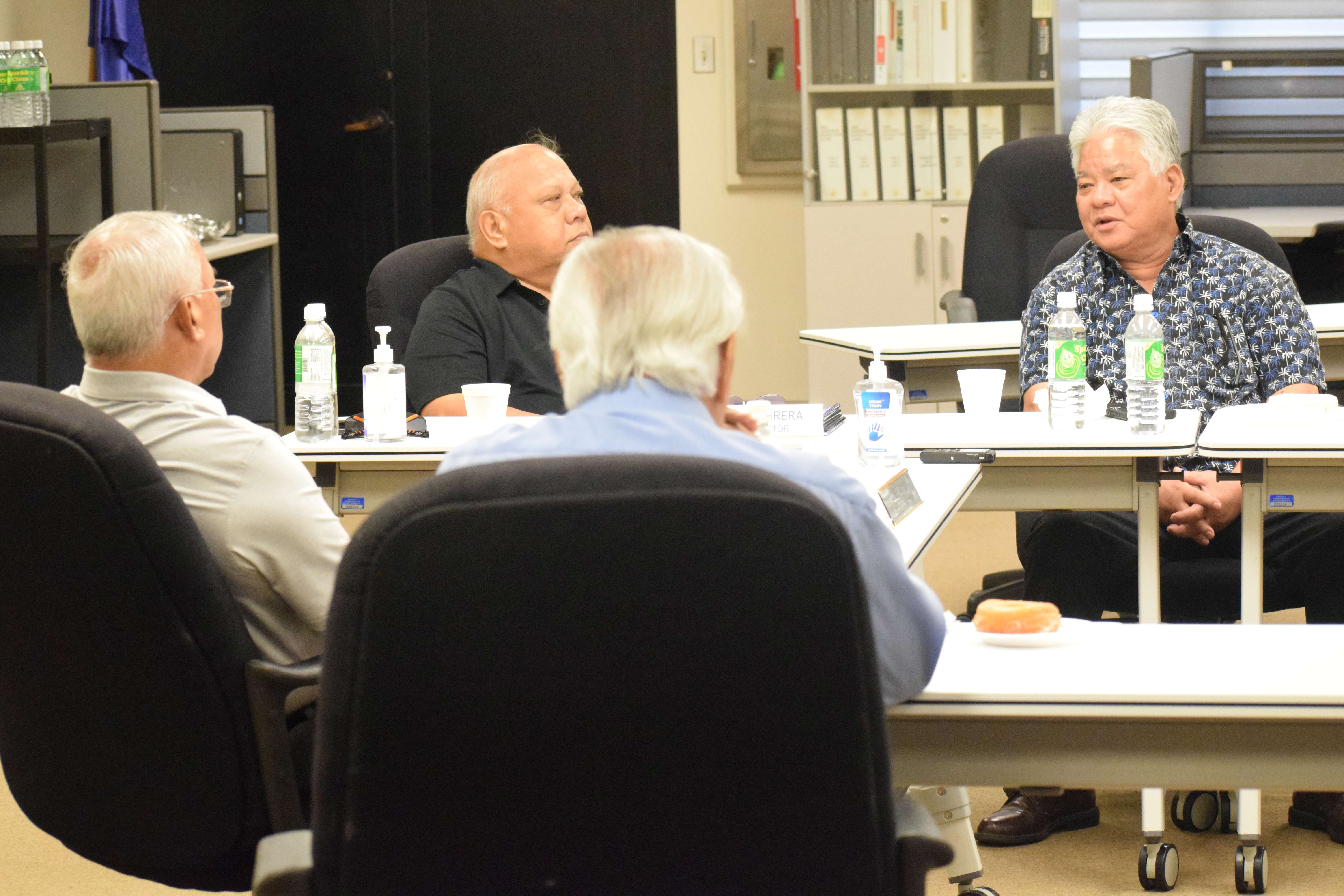 Gov. Arnold I. Palacios, right, speaks to the Commonwealth Ports Authority members and other officials during a CPA board meeting on Tuesday in the Aircraft Rescue and Firefighting classroom at the Francisco C. Ada/Saipan International Airport.
