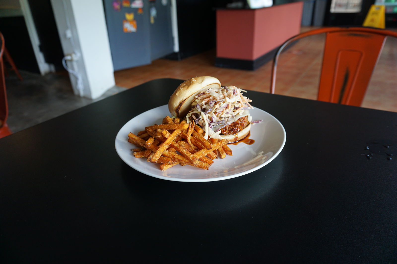 This ain't your mama's KFC--this is the Korean Fried Chicken at Ina's Kitchen, a breaded, deep fried chicken breast covered in Chef Sonny’Spicy Korean Sauce, pepper jack cheese, and pika slaw.  