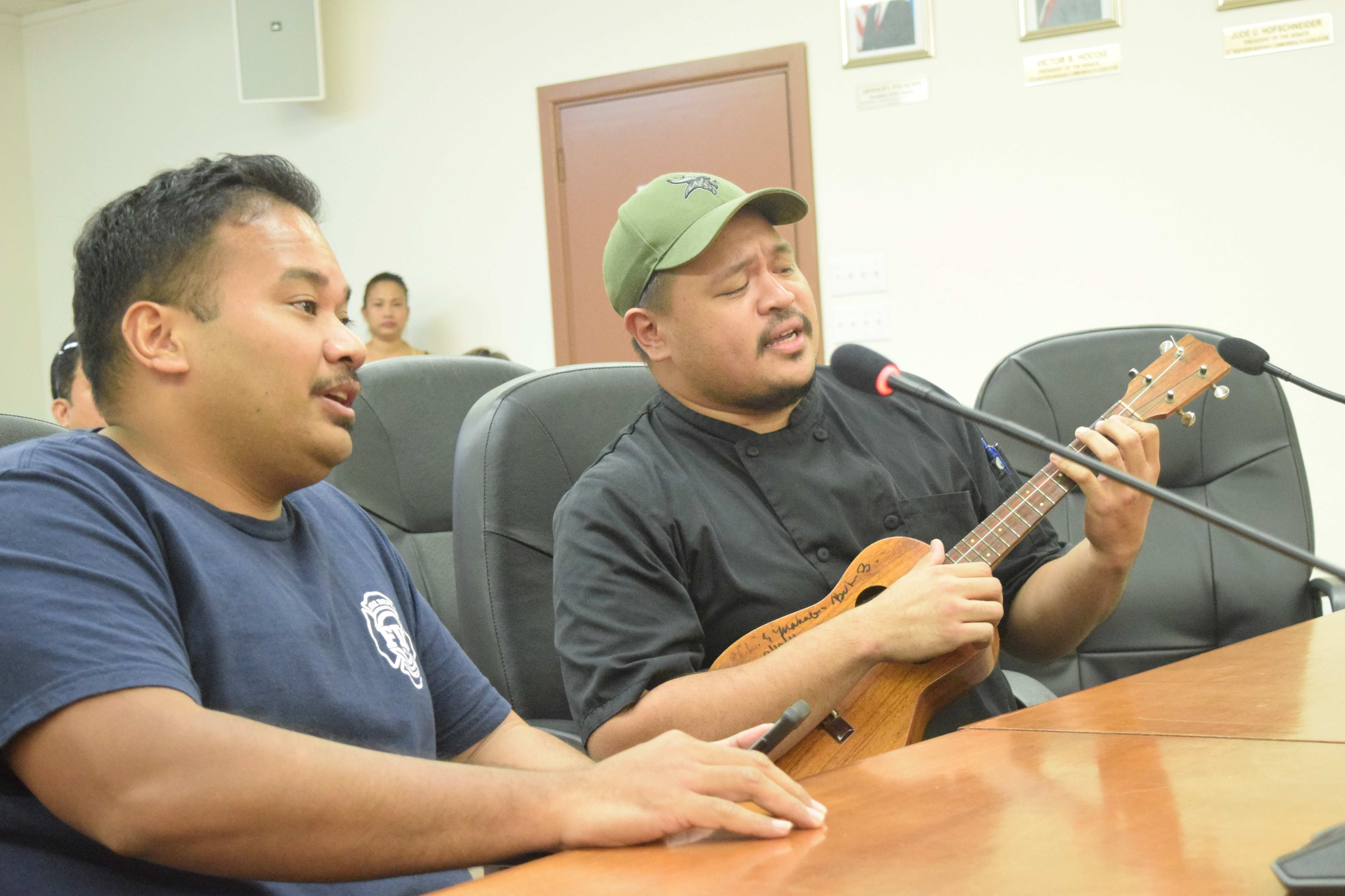 Donovan Castro and Dwayne Castro perform a musical number in the Senate chamber.
