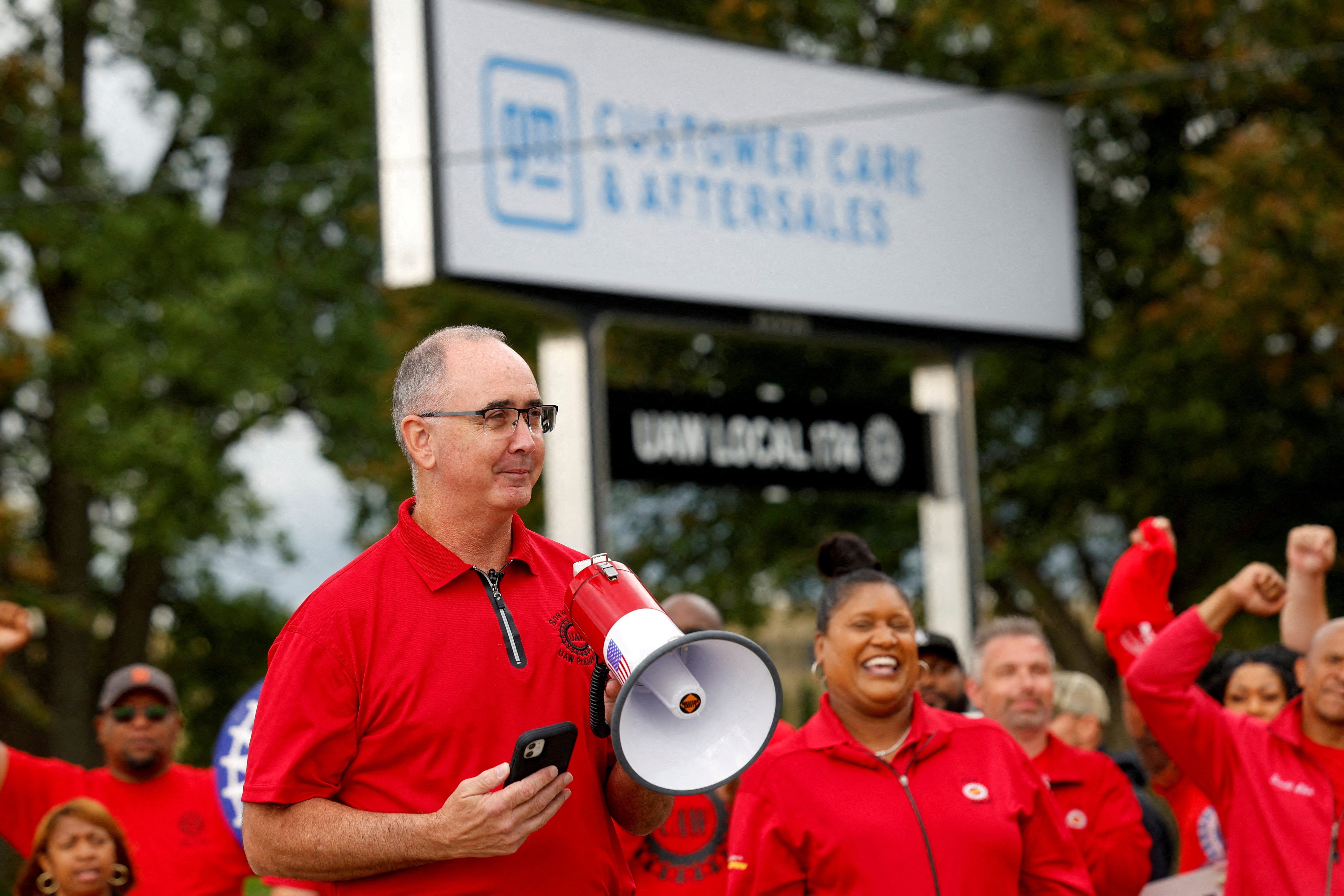 Shawn Fain, president of the United Auto Workers (UAW) speaks as U.S. President Joe Biden (not pictured) joins striking members of the United Auto Workers (UAW) on the picket line outside GM's Willow Run Distribution Center, in Belleville, Wayne County, Michigan, U.S., September 26, 2023. 