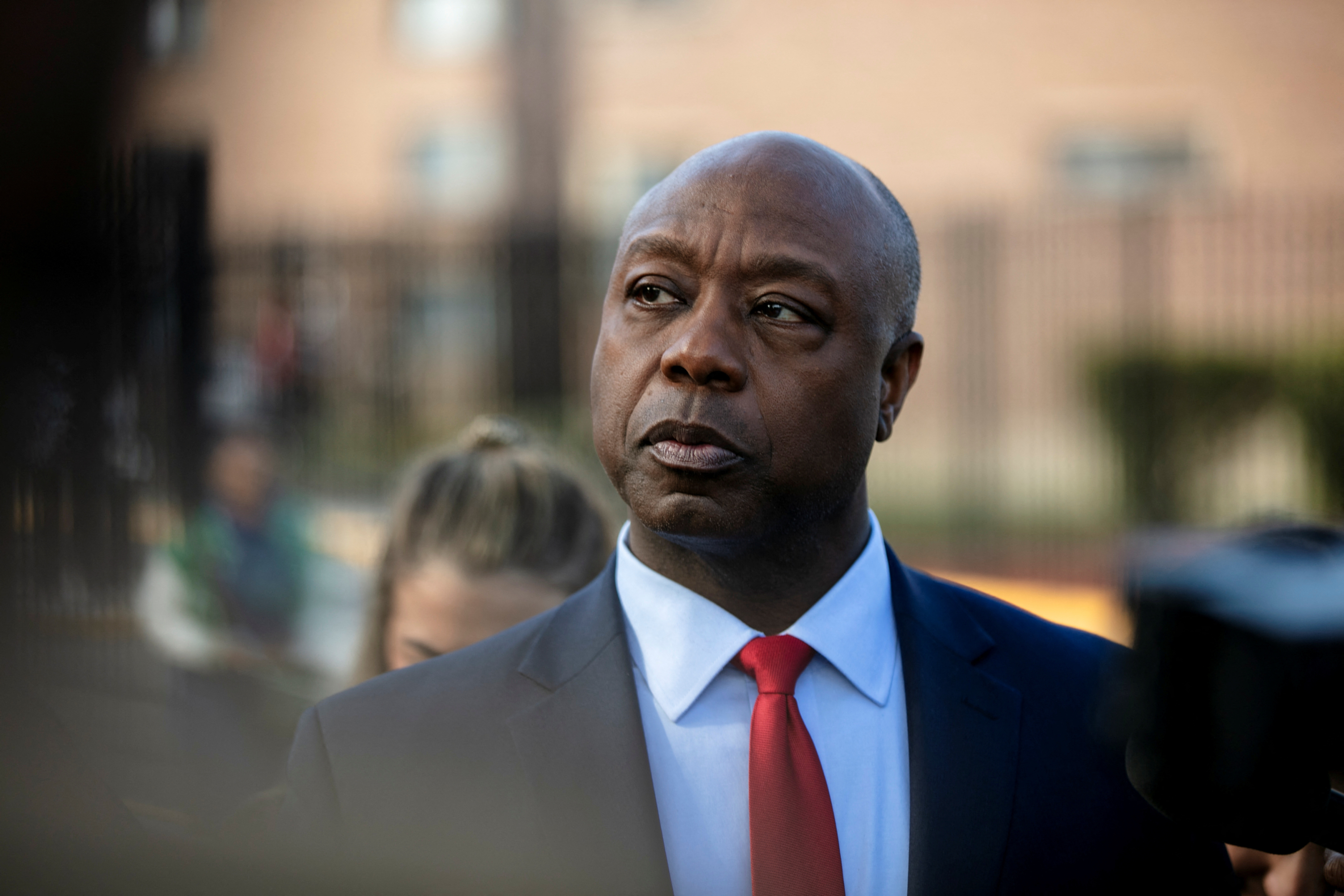 Republican presidential candidate U.S. Senator Tim Scott (R-SC) looks on as he tours the neighbourhood around New Beginnings Church in Chicago, Illinois, U.S., October 23, 2023. 