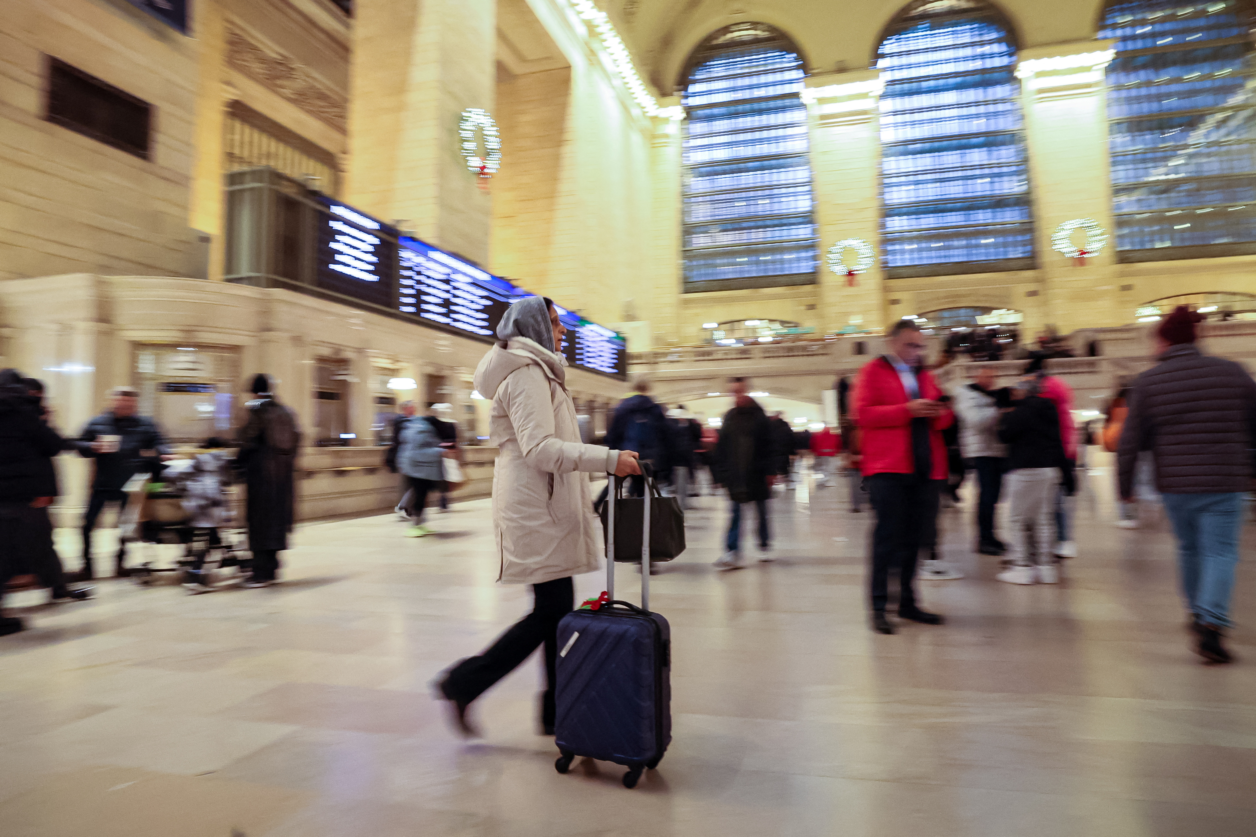 Travelers navigate through Grand Central Terminal, as people begin to travel ahead of the Thanksgiving holiday, in New York City, U.S., November 21, 2023. 