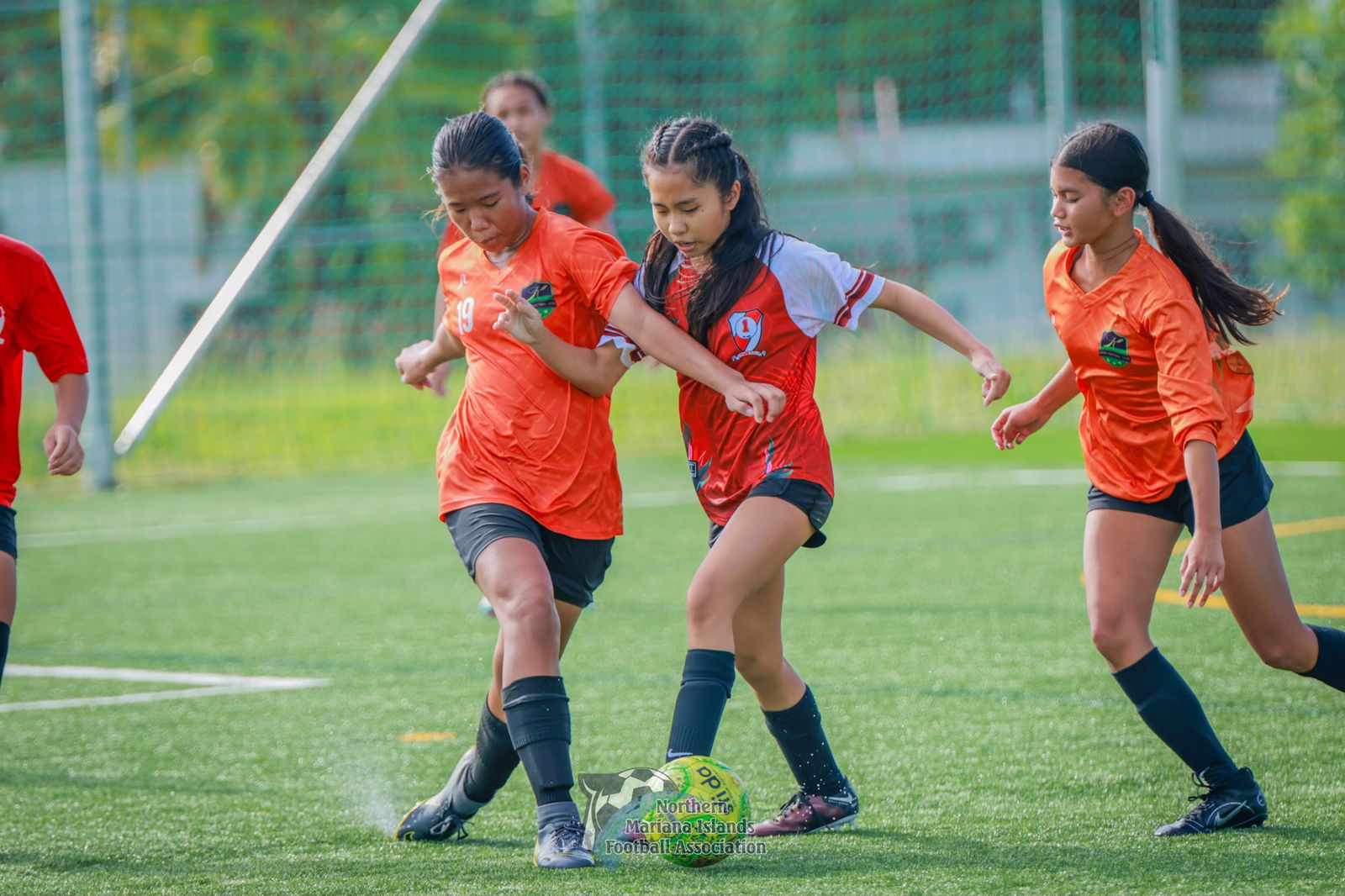 Kanoa's Ye Lynn Ha battles for the possession during a U14 girls division game of the TakeCare Youth Soccer League Fall 2023 at the NMI Soccer Training Center in Koblerville.