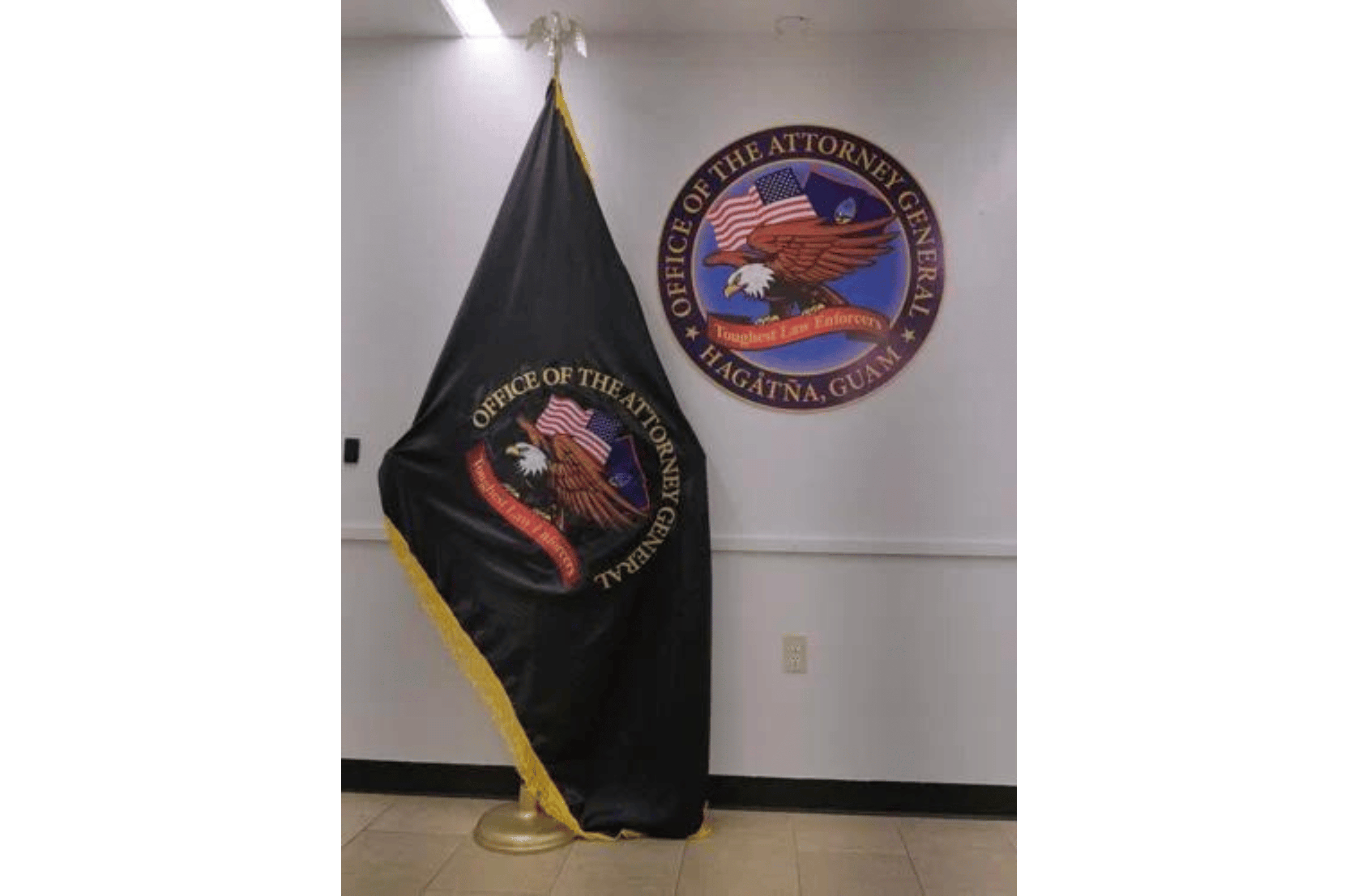 A flag and seal for the Office of the Attorney General of Guam is seen at the ITC building in Tamuning Thursday, May 4, 2023. 
