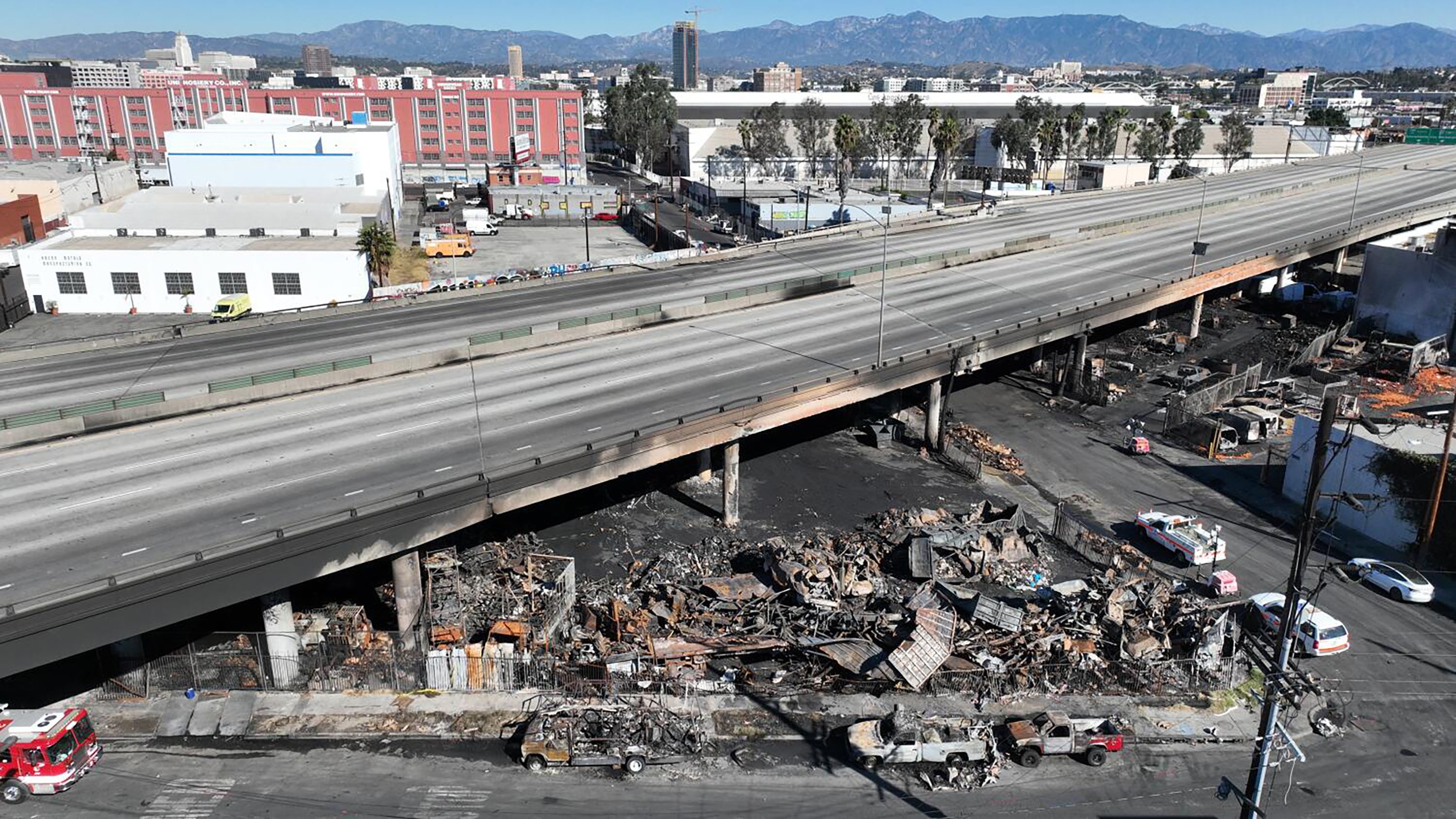 Aerial views of the 10 Freeway after a large pallet fire burned below, shutting the freeway to traffic, on Nov. 12, 2023, in Los Angeles. (Robert Gauthier/Los Angeles Times/TNS)