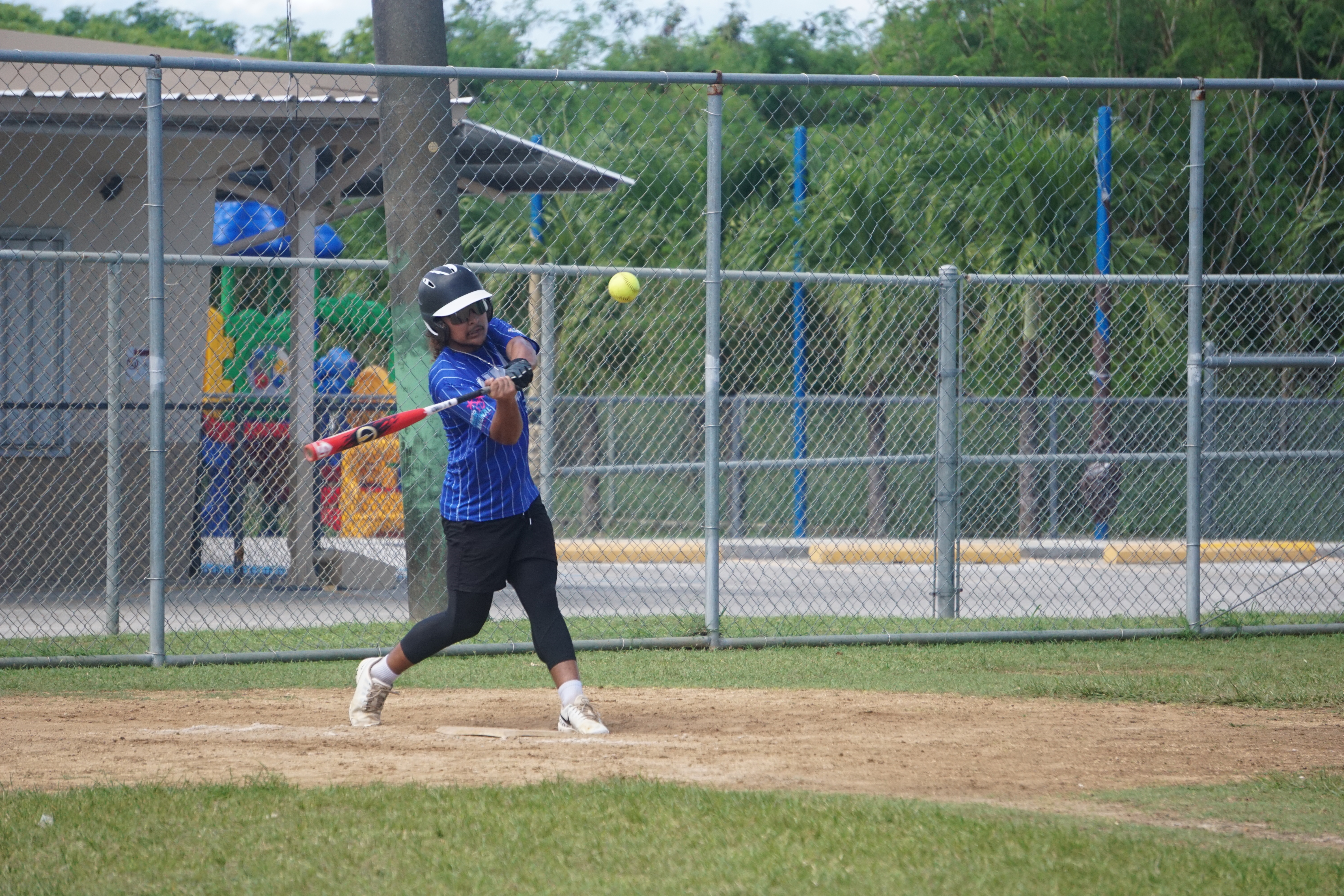 KHS V's Joell Borja connects a single during a game of the SBL-PSS Interscholastic Boys High School Slow Pitch Softball League SY23-24 at the Dandan baseball field.