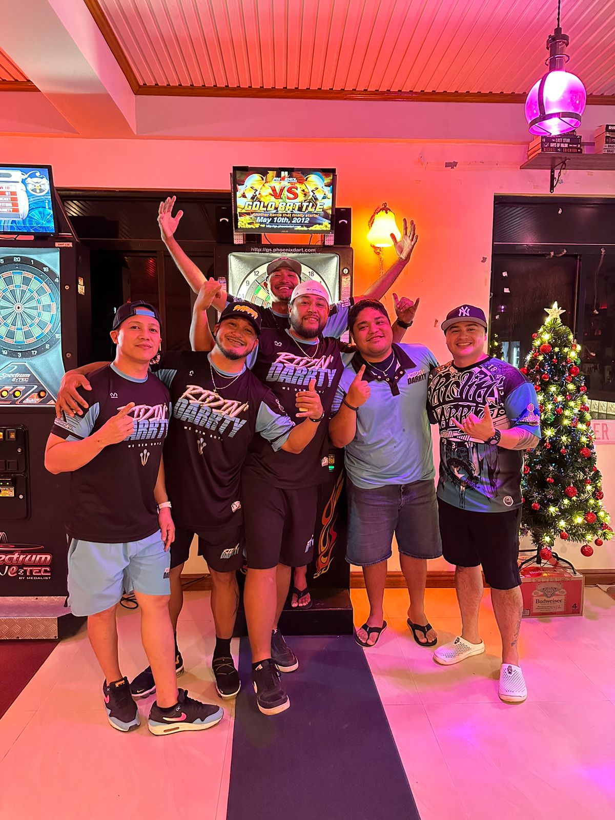 Members of team Spicy Thai Ridin' Darty pose for a photo after winning the A Division Bud Light Cup of the 2023 SEDA Bud Light Dart League on Monday at the Spicy Thai Restaurant. 