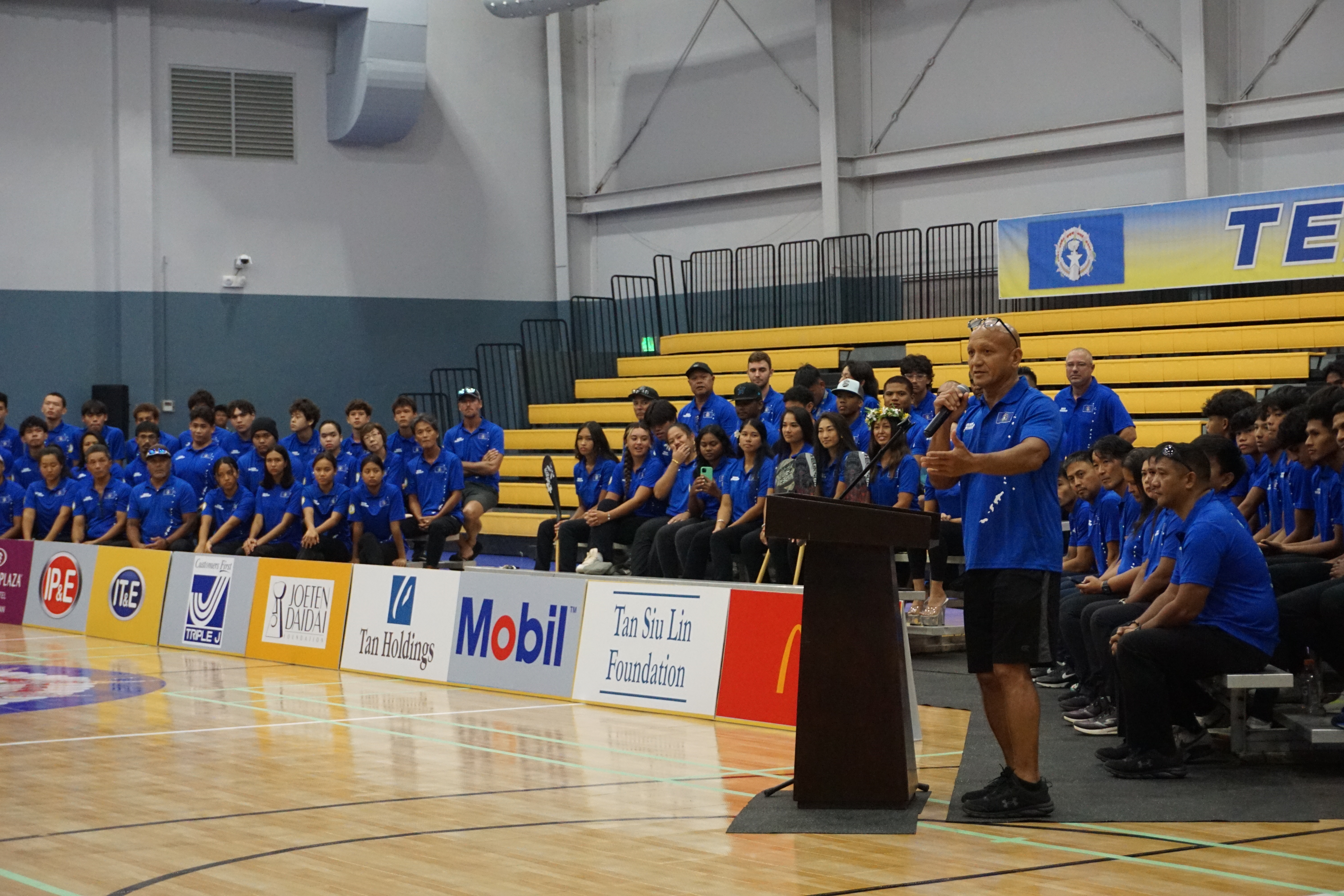 NMI athlete and coach Jason Tarkong delivers his remarks during a sendoff ceremony on Wednesday at the Ada gym.