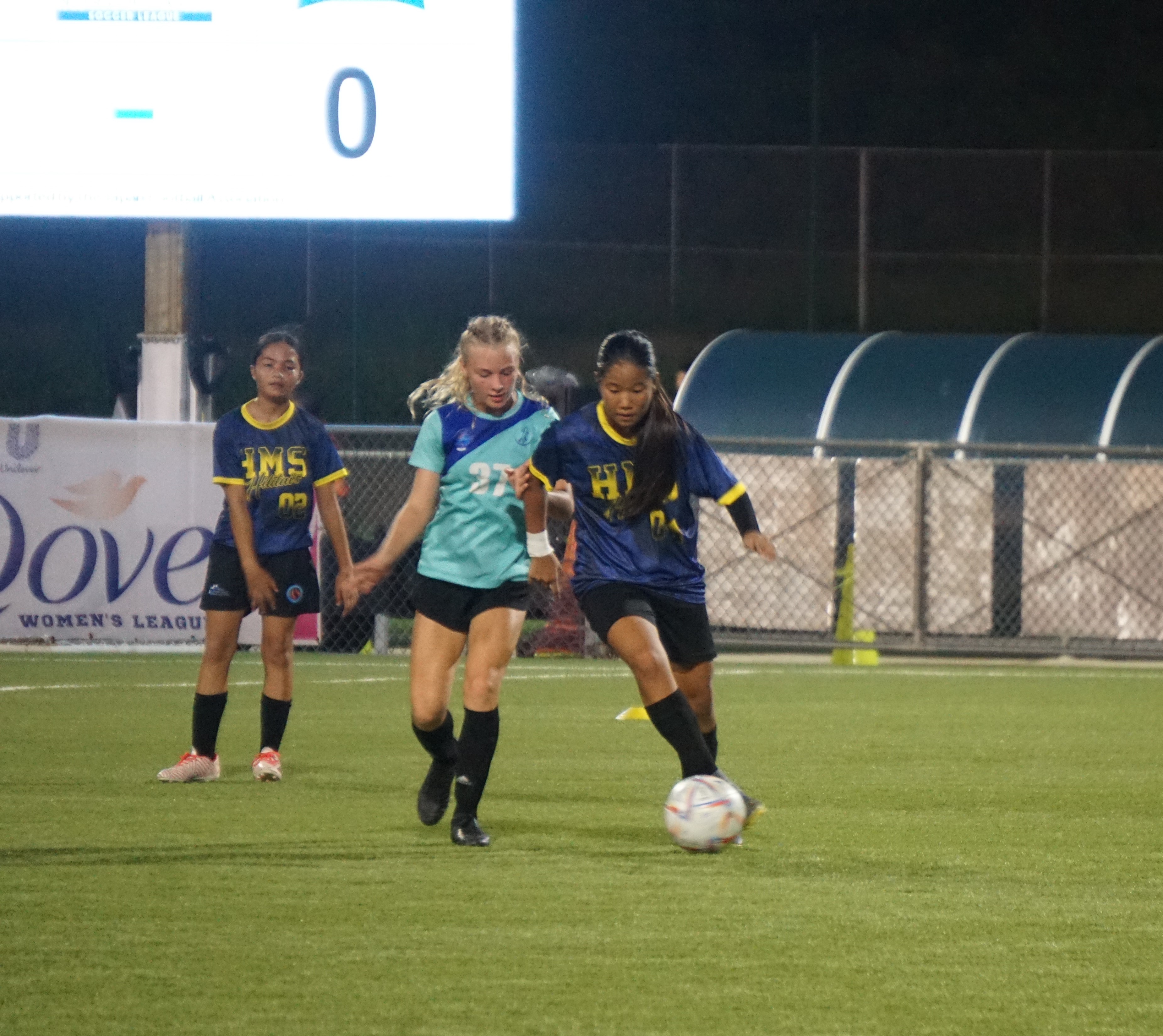 Hopwood’s Yelynn Ha and SIS's Addalee Taflinger battle for the possession during the girls middle school division championship of the NMIFA-PSS Interscholastic Soccer League at the NMI Soccer Training Center in Koblerville on Thursday.