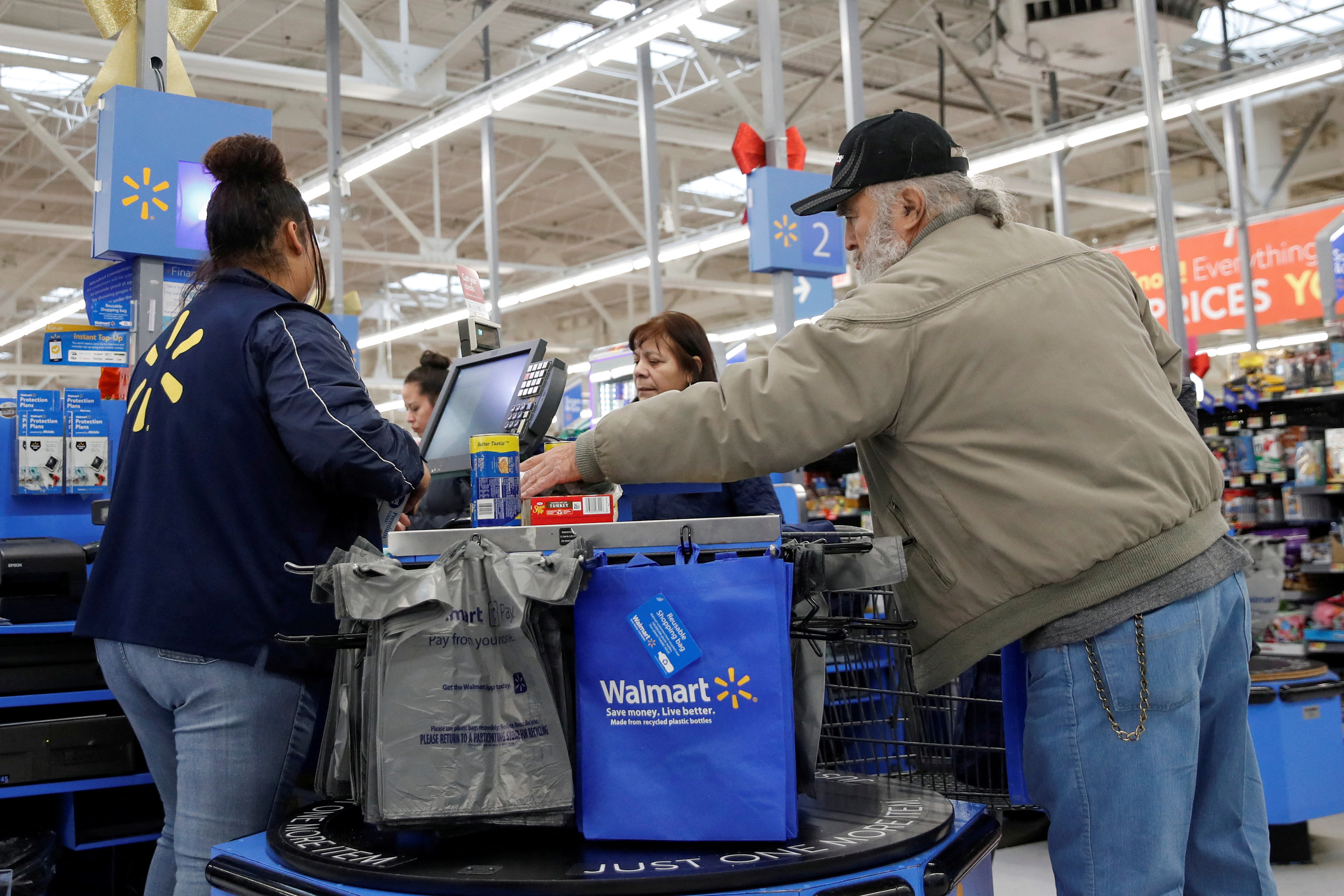 A customer bags his groceries after shopping at a Walmart store ahead of the Thanksgiving holiday in Chicago, Illinois, U.S. November 27, 2019. 