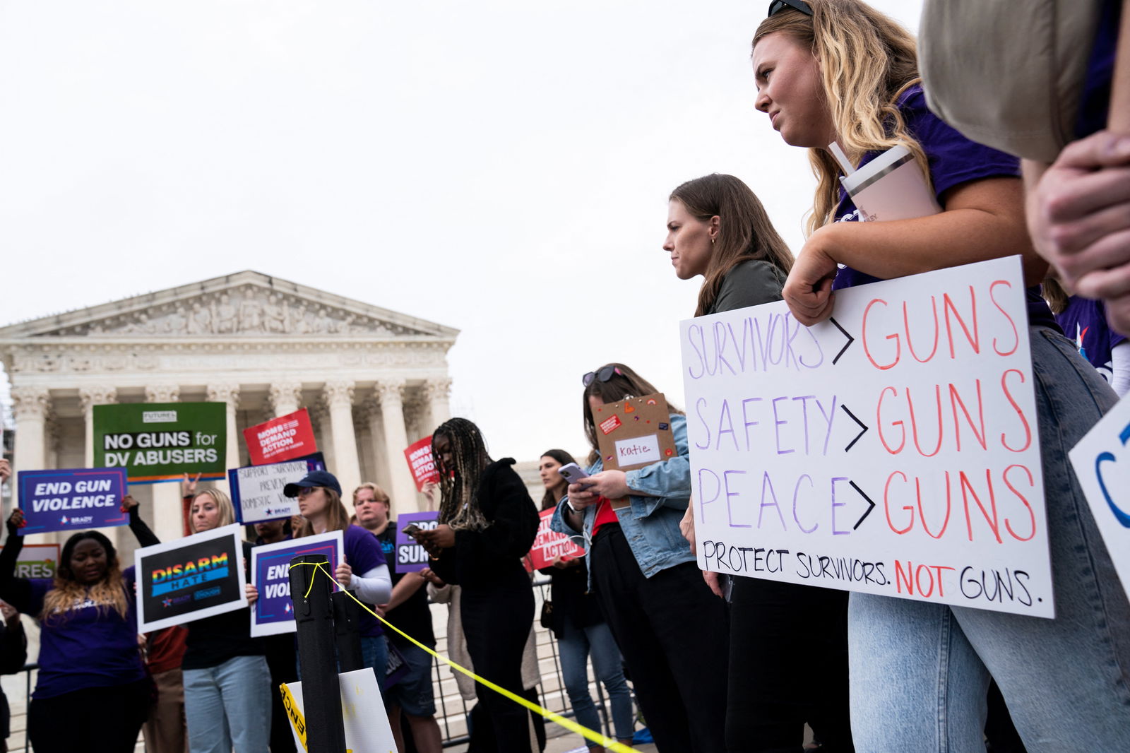 People participate in a demonstration as the US Supreme Court considers legality of domestic-violence gun curbs at the Supreme Court in Washington, D.C., U.S., November 7, 2023. 