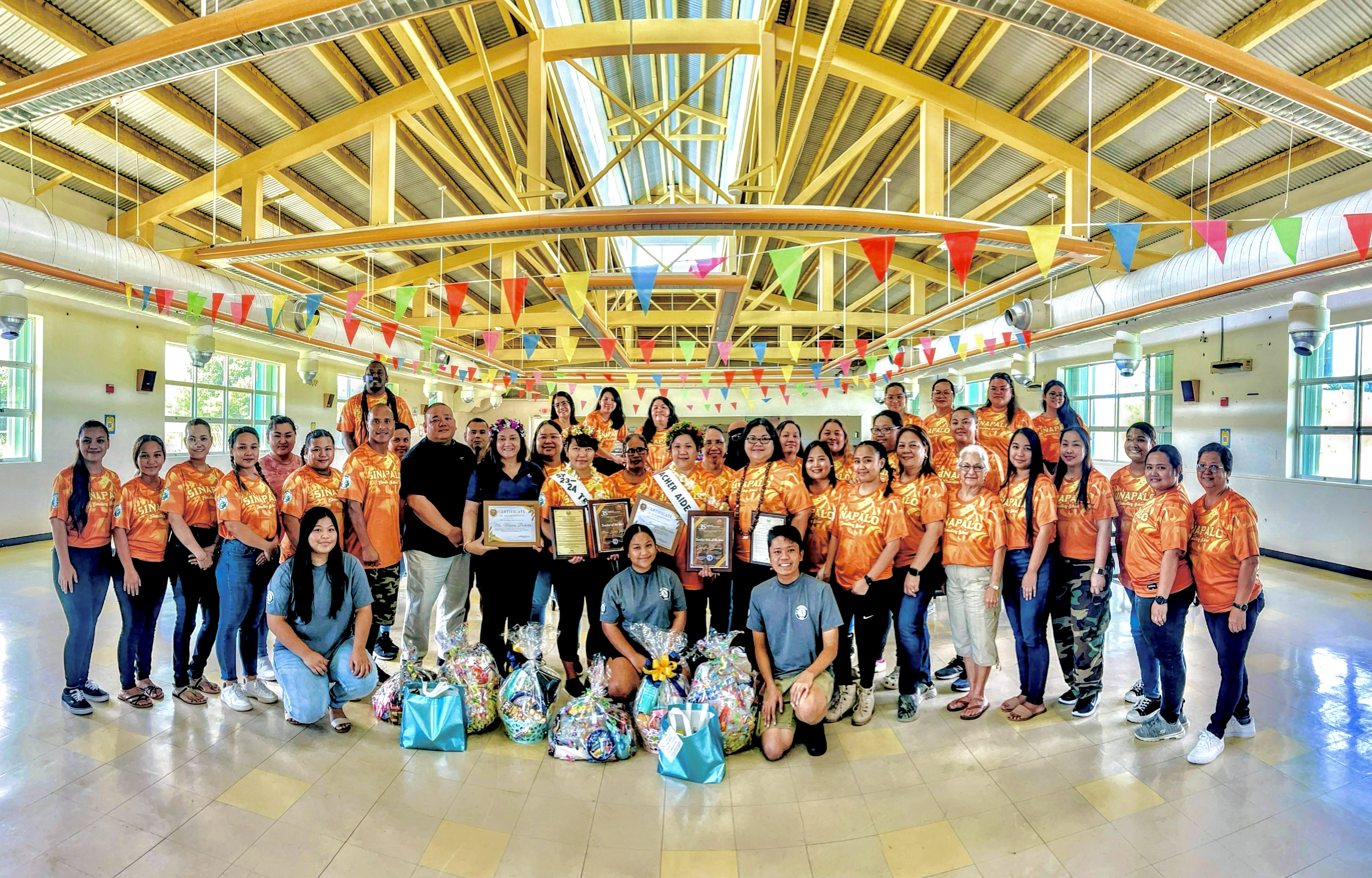Interim Commissioner of Education Donna M. Flores and Associate Commissioner for Administrative Services Eric Magofna with Rota’s Sinapalo Elementary School staff, personnel and students led by Principal Daisy Quitugua during the Education Day celebration in the school cafeteria on Nov. 21, 2023.