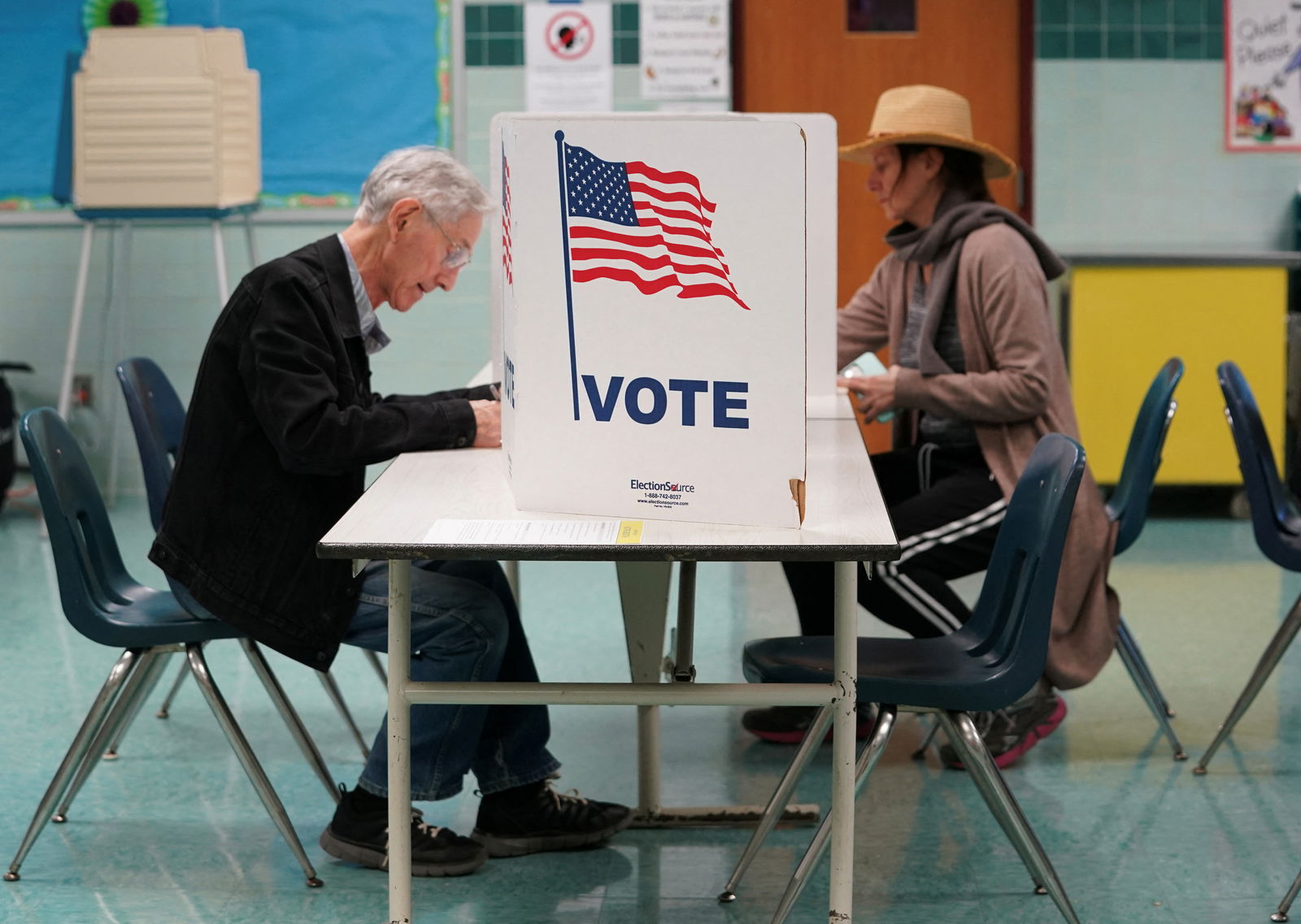 Voters cast their ballots at a polling station on Election Day in Falls Church, Virginia, U.S., November 7, 2023. 