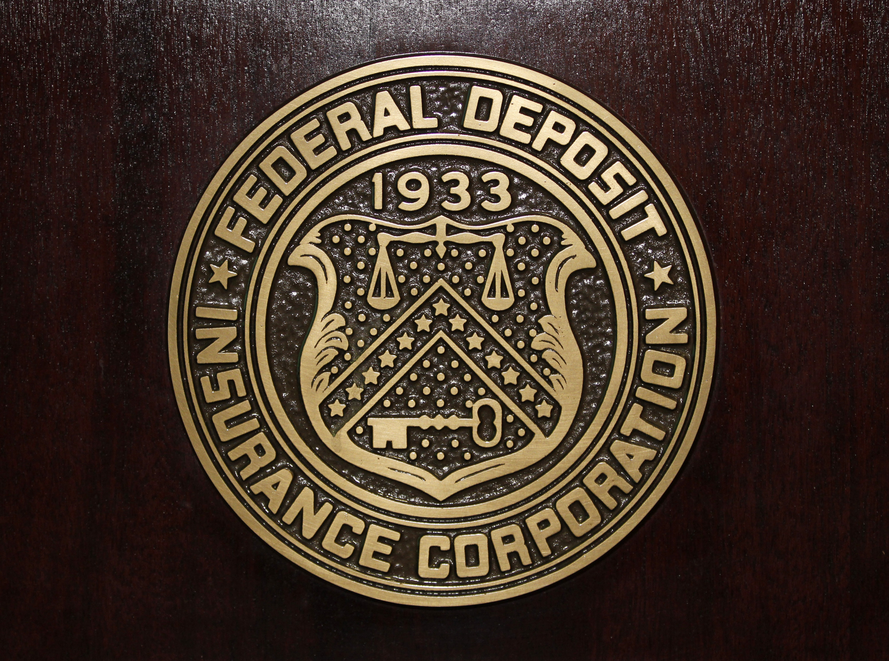 The Federal Deposit Insurance Corp (FDIC) logo is seen at the FDIC headquarters as Chairman Sheila Bair announces the bank and thrift industry earnings for the fourth quarter 2010, in Washington, February 23, 2011. 