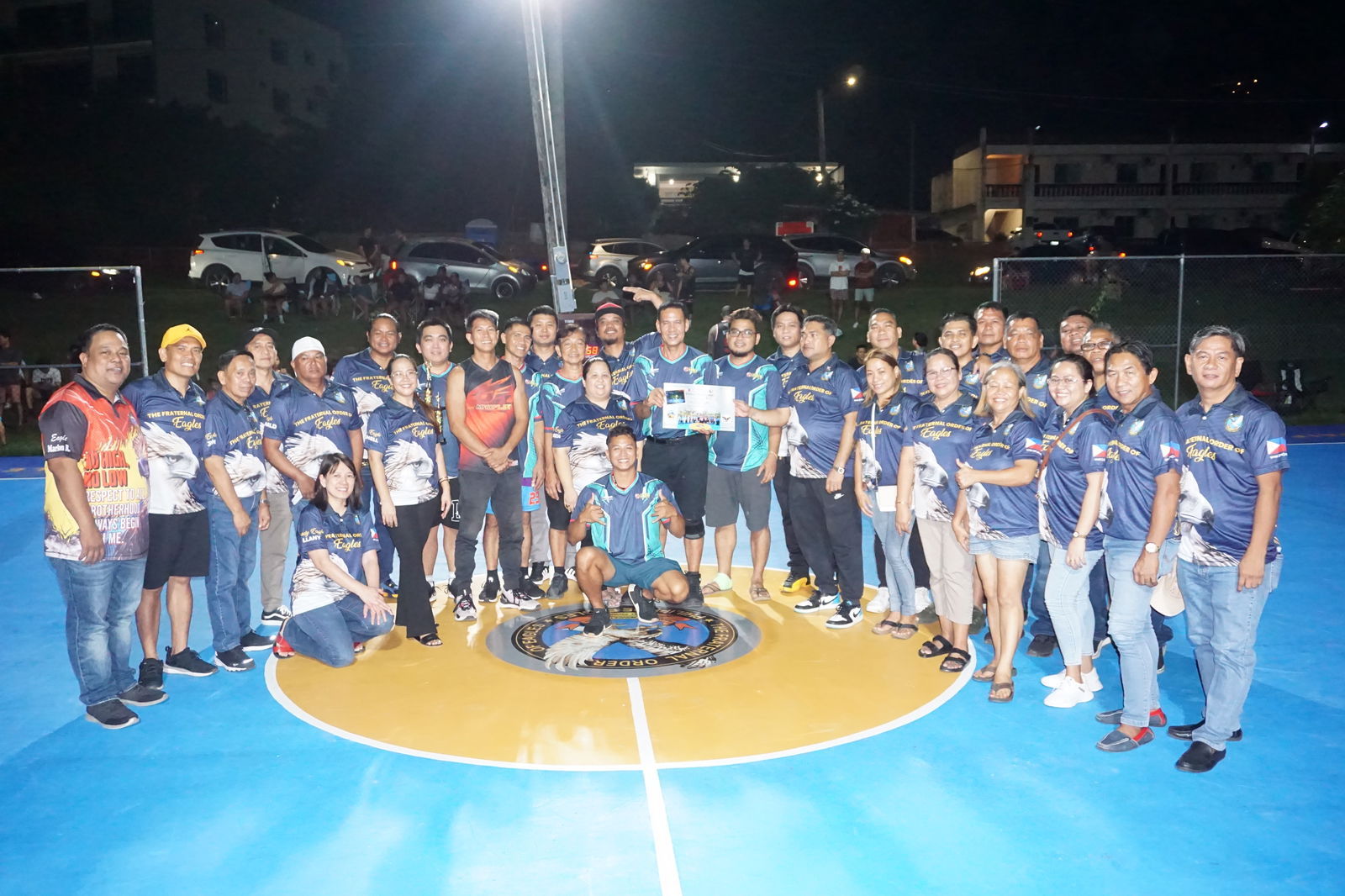 Sonny Ebuen, center, receives a Certificate of Appreciation from the officers and members of the Saipan Magalahi Eagles Club, which organized an invitational basketball tournament that concluded on  Saturday at the Gualo Rai basketball court.