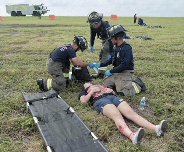 Guam Fire Department firefighters respond to personnel role-playing as victims during Guam International Airport Authority's Triennial Full-Scale Disaster Exercise in Tamuning on Wednesday, Nov. 15, 2023. 
