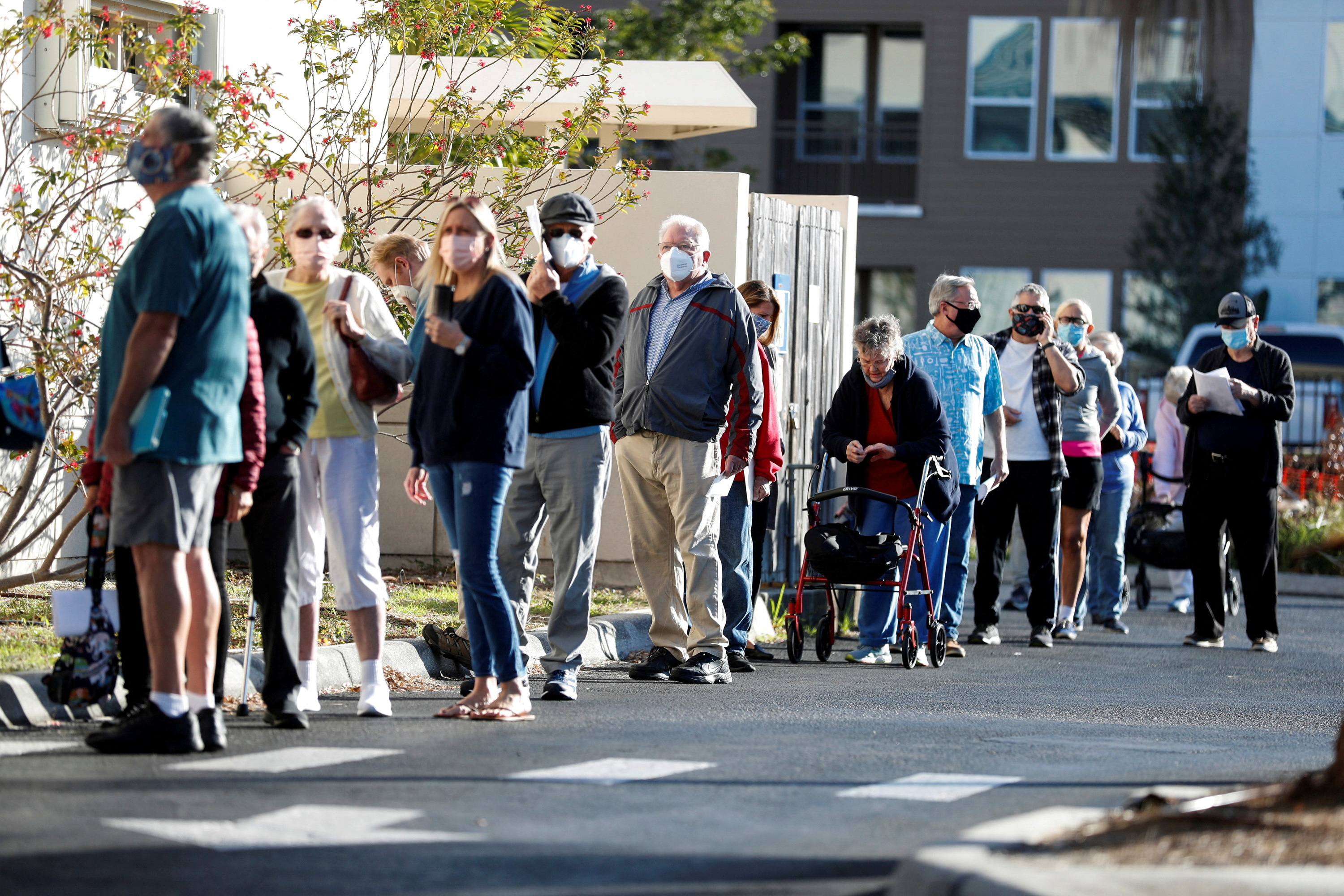 Seniors, who are 65 and over, wait in line at the Department of Health Sarasota COVID-19 Vaccination Clinic in Sarasota, Florida, U.S. January 4, 2021. 