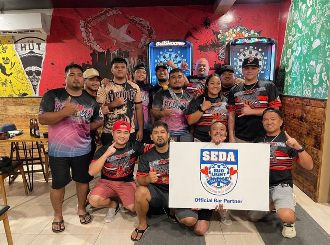 The Hut Triple Cherry Bull and 9Eleven Rookies pose for a photo after their Bud Light Cup championship game in the C "Kingfisher" Division of the 2023 SEDA Bud Light Dart League at The Hut on Wednesday.