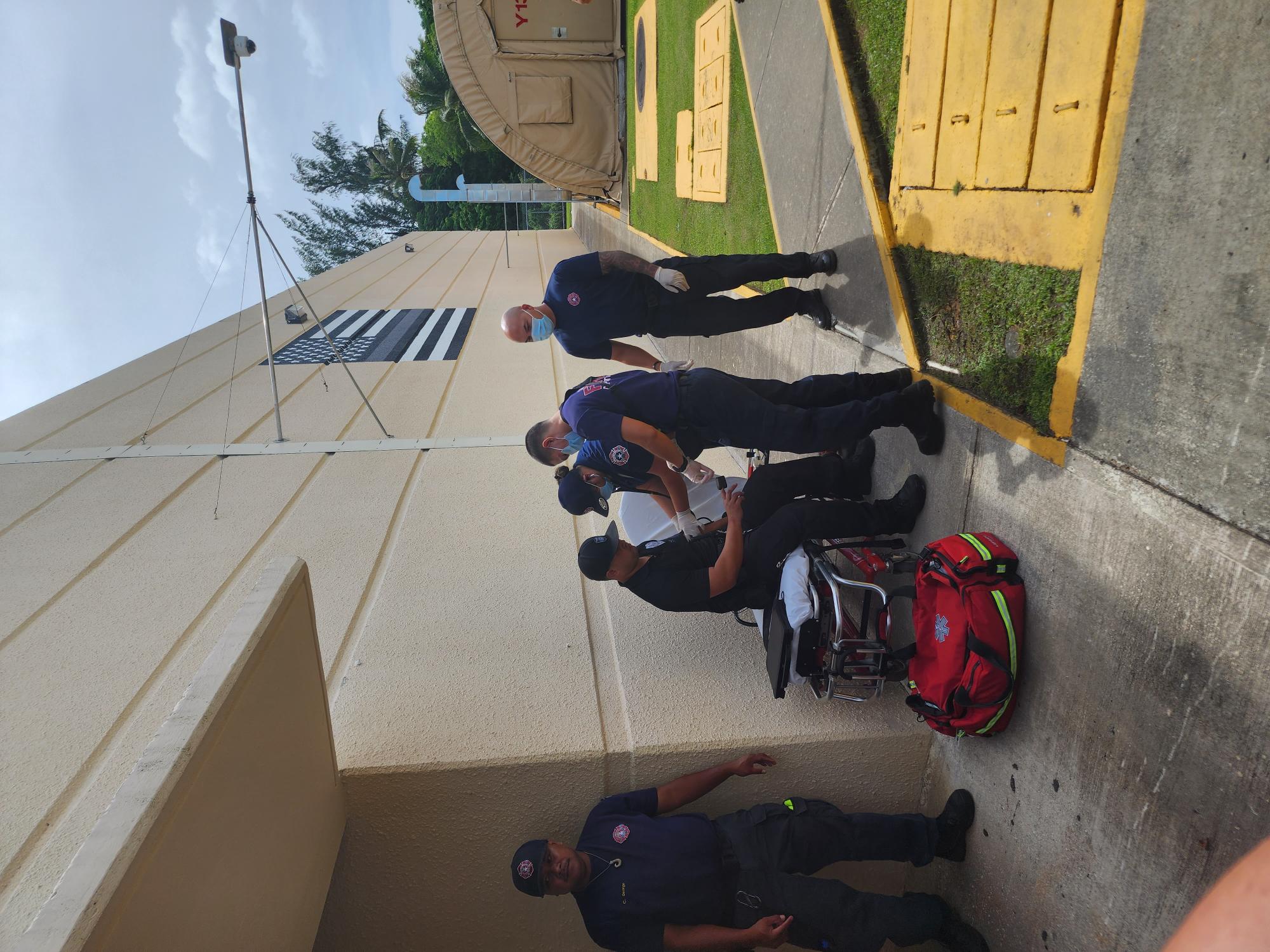 DFEMS personnel conduct a “medical assessment” of the Corrections officer who was “held hostage” by inmates as part of the 2023 KONFITMA Exercise.