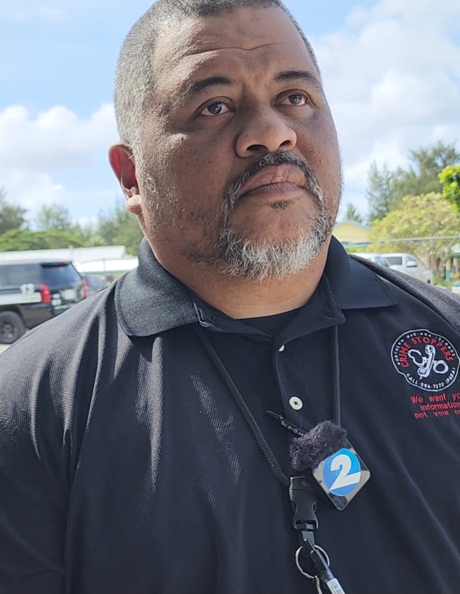 DPS public information officer Sgt. Fred Sato talks to reporters regarding the incident at Francisco M. Sablan Middle School on Thursday afternoon.