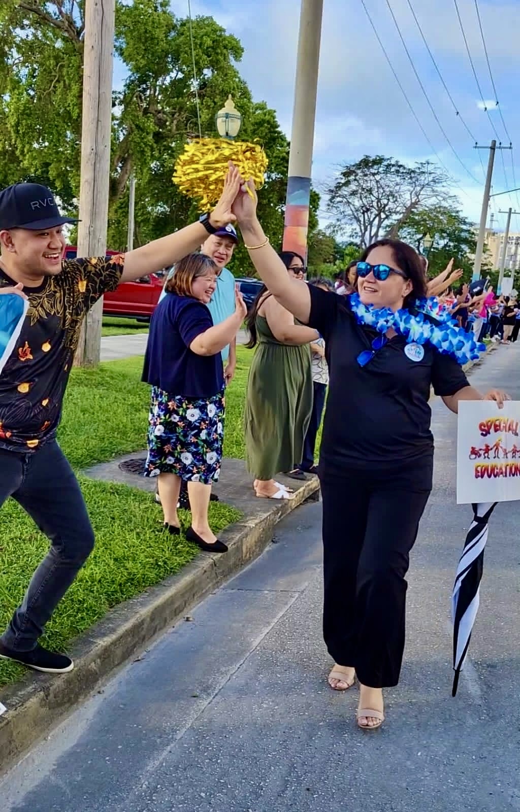 Interim Commissioner of Education and Special Education Program Director Donna M. Flores led PSS staff and personnel in a festive roadside waving event on Saipan.
