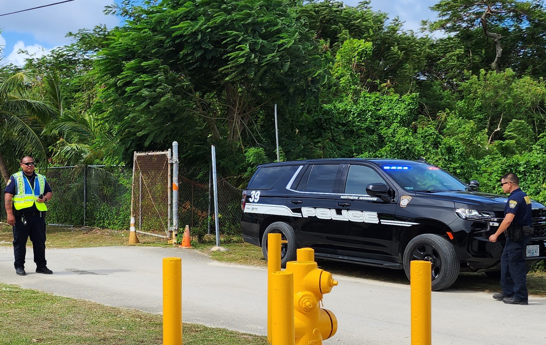 Police officers respond to a bomb threat at Francisco M. Sablan Middle School on Thursday.