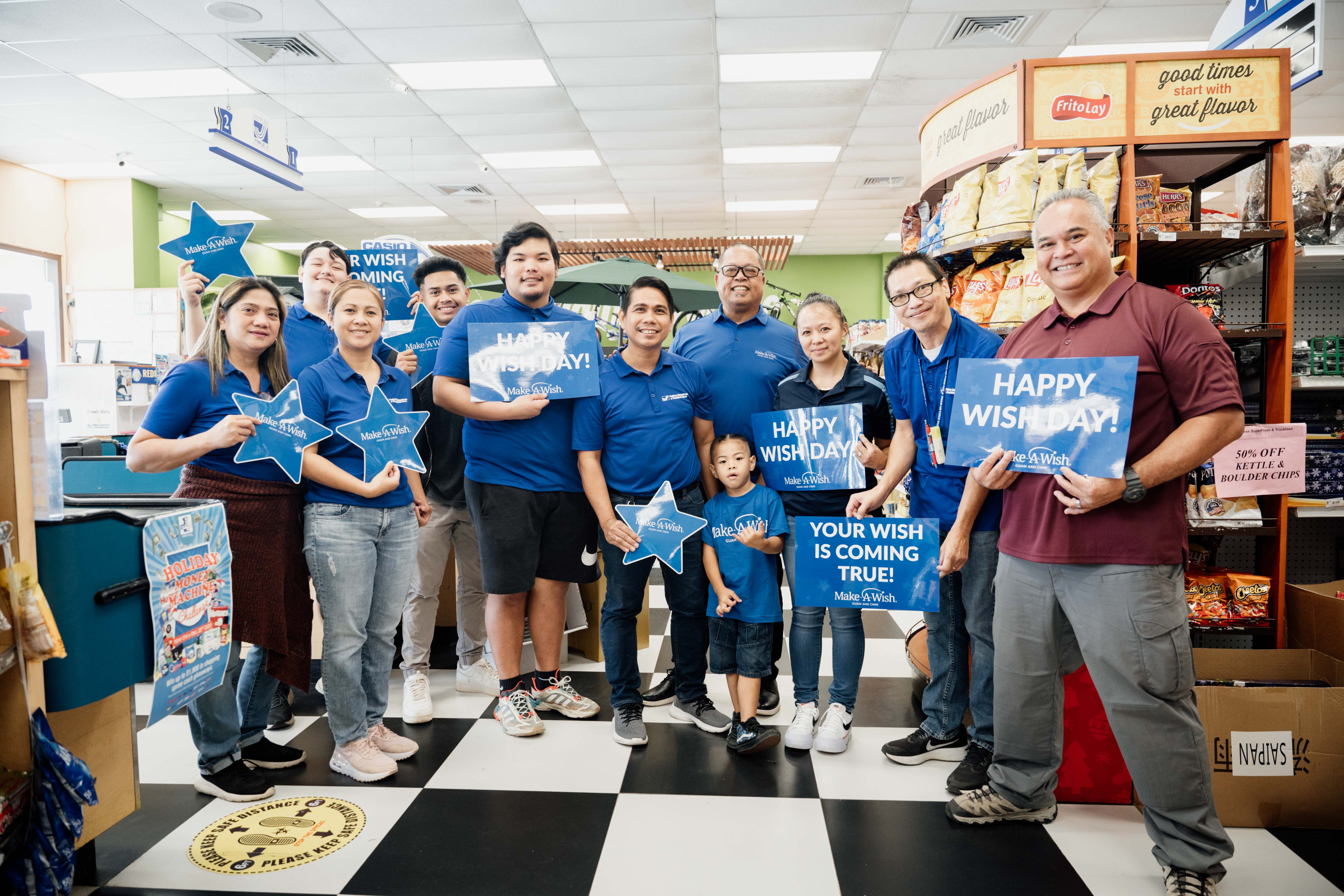 Andreas takes time for a photo with Make-A-Wish of Guam and CNMI board member/Triple J Wholesale & Retail General Manager Jay Santos and Triple J Payless SuperFresh and Truckload Store team members at his recent shopping spree.