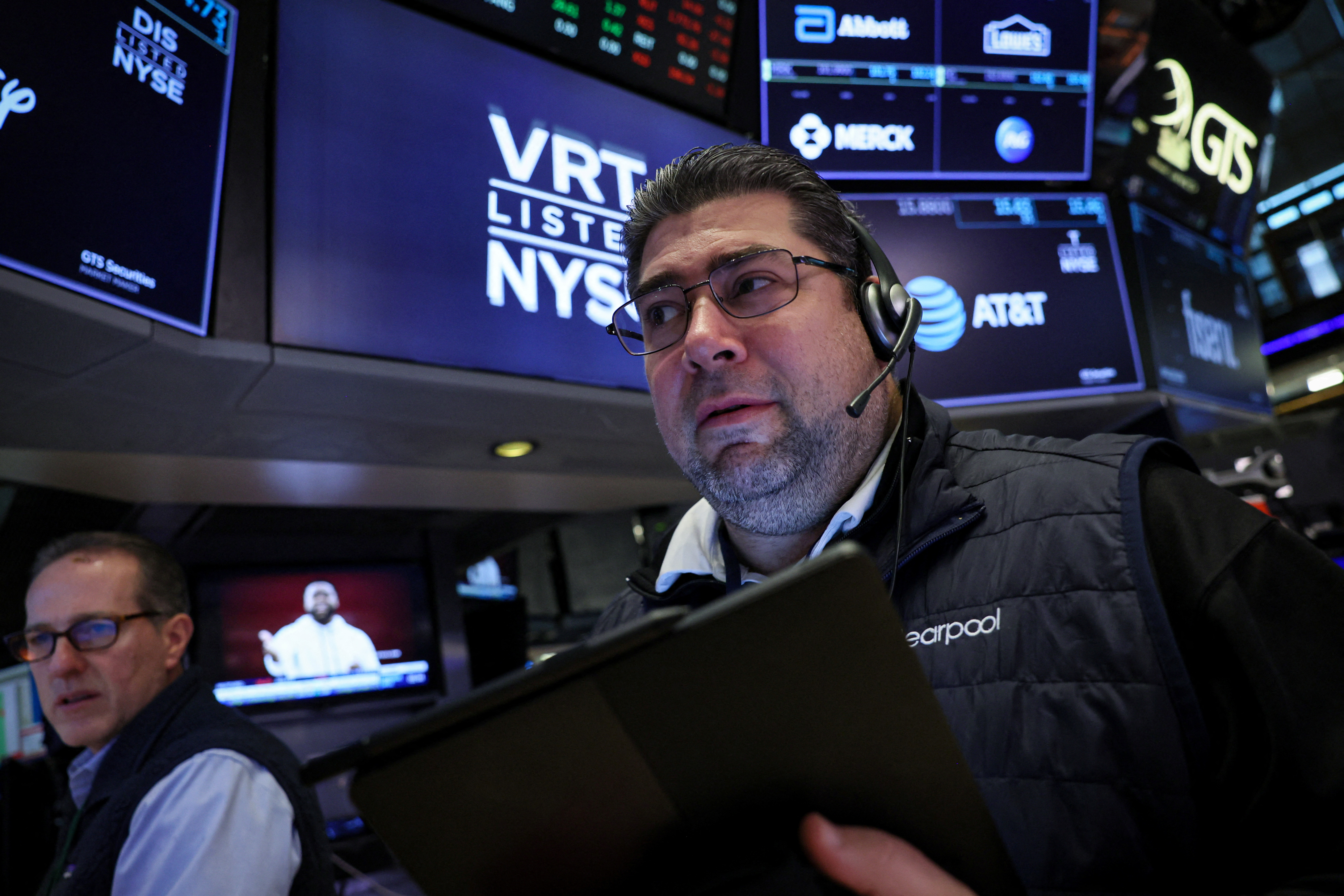Traders work on the floor at the New York Stock Exchange (NYSE) in New York City, U.S., November 17, 2023. 