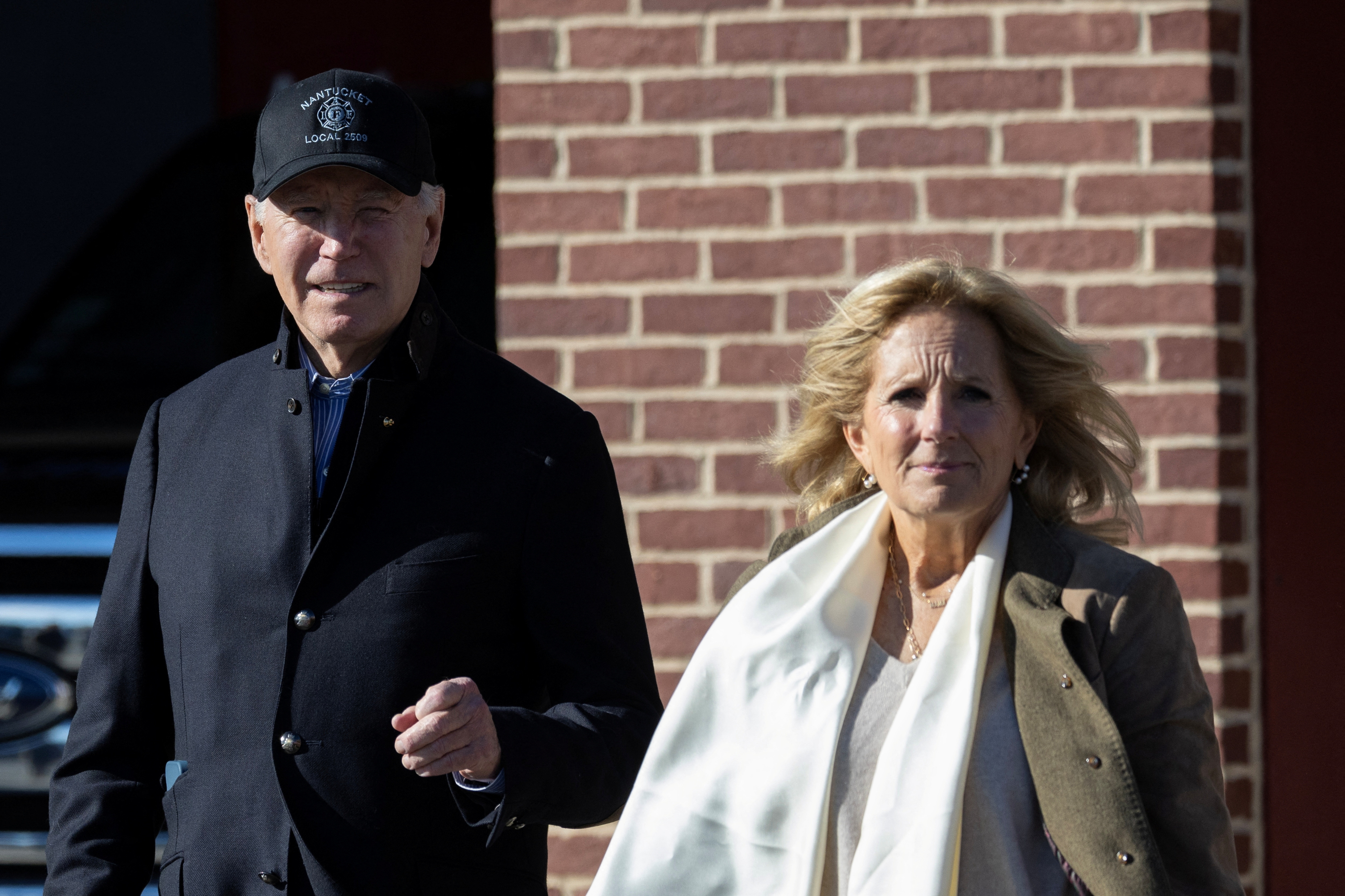 U.S. President Joe Biden and First Lady Jill Biden walk to the presidential motorcade following a visit to the Nantucket Fire Department in Nantucket, Massachusetts, U.S, November 23, 2023. 