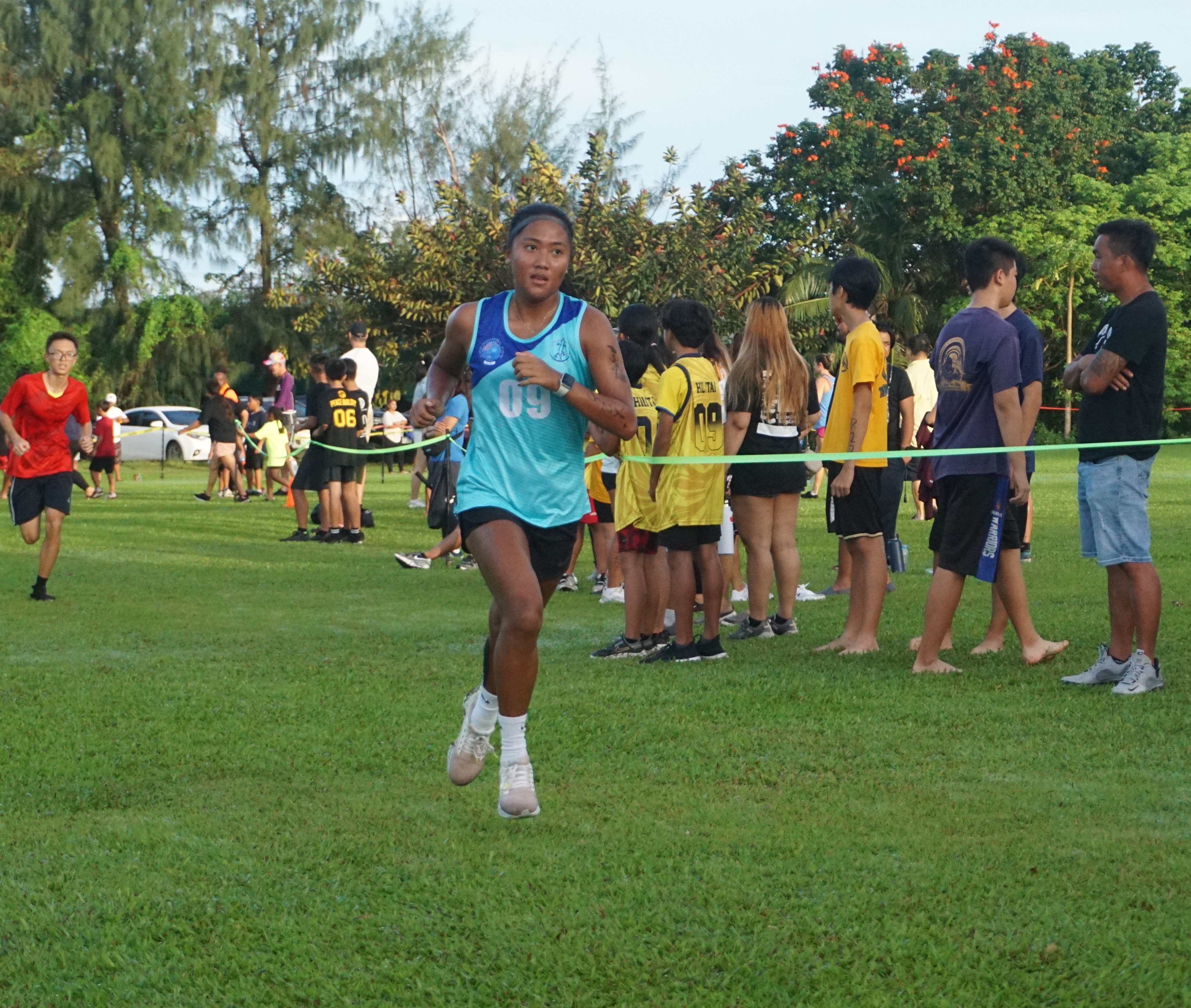 Kaithlyn Chavez pushes through to finish first in the girls high school division of the PSS-NMA All School Cross Country Series SY23-24 on Saturday at the Saipan Country Club of Saipan Vegas.