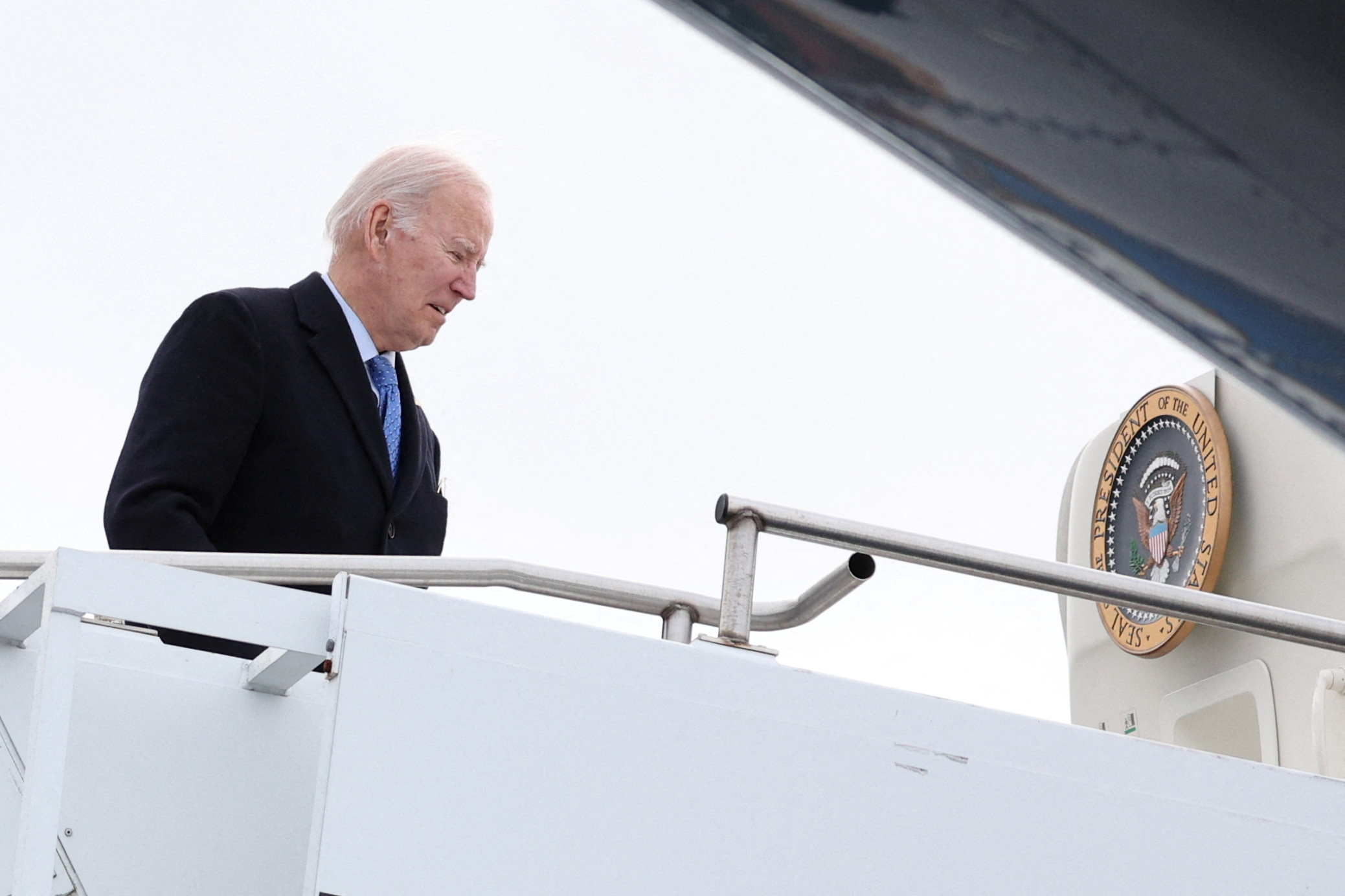 U.S. President Joe Biden boards Air Force One at Nantucket Memorial Airport in Nantucket, Massachusetts, U.S., November 26, 2023. 