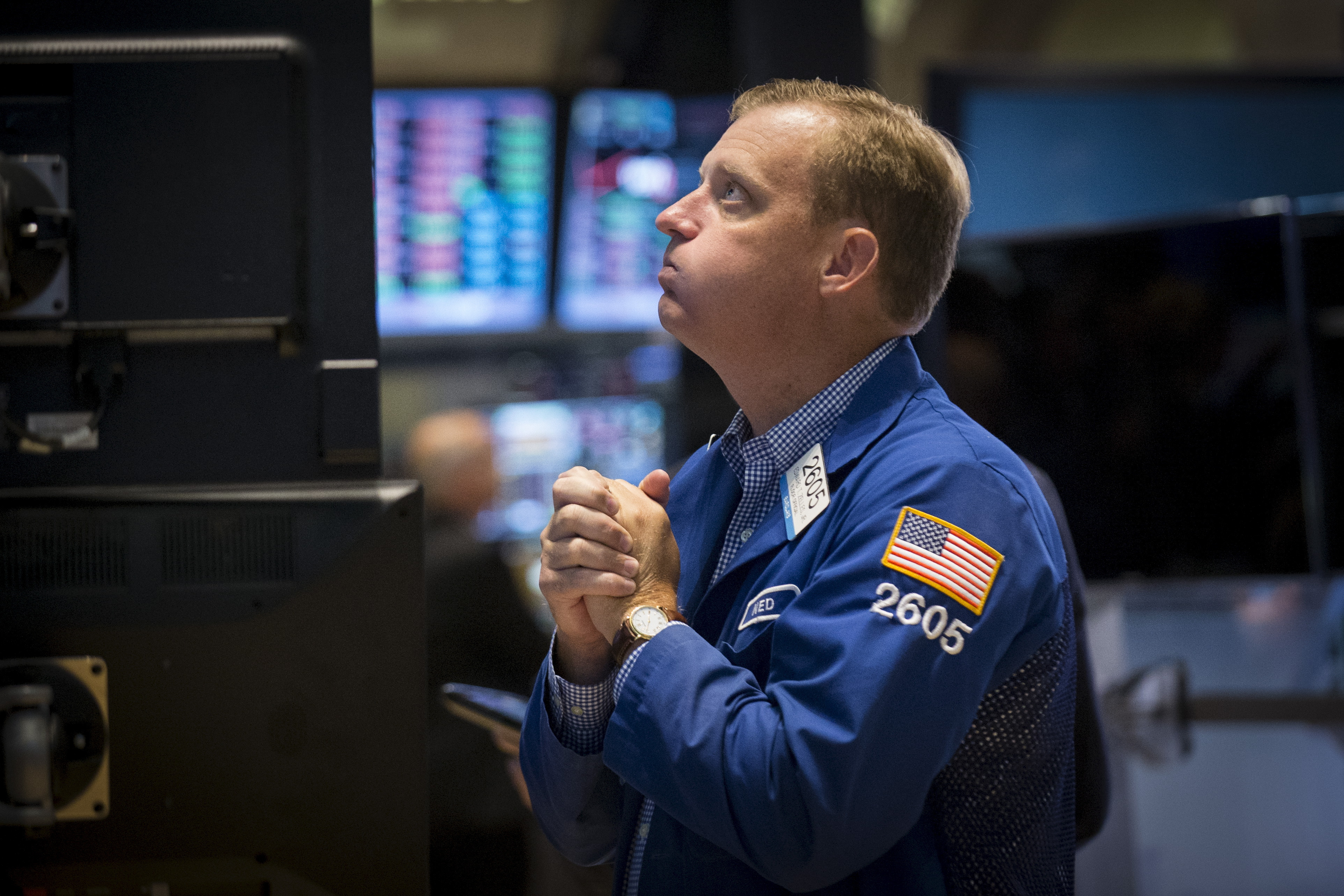 Specialist trader Ned Zelles works at his post on the floor of the New York Stock Exchange, August 21, 2015. 