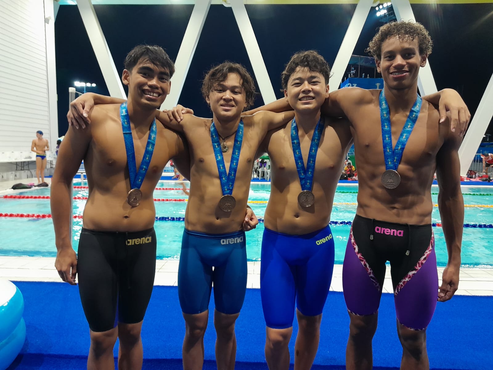 NMI swimmers, from left, Kean Pajarillaga, Juhn Tenorio, Taiyo Akimaru, and Isaiah Aleksenko.