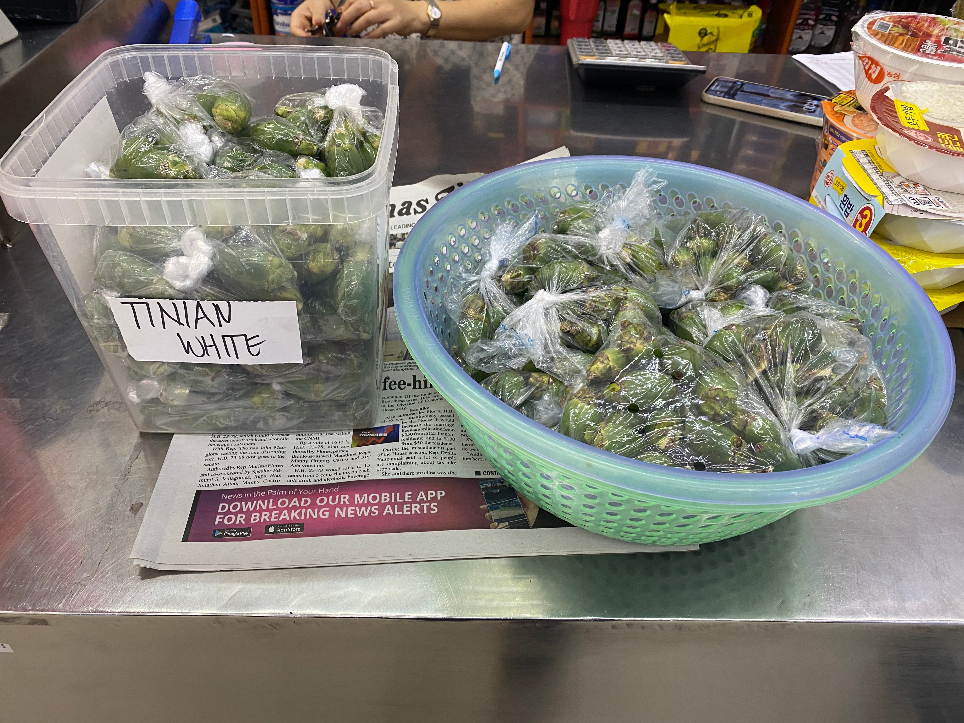 Two baskets of pugua await customers inside a store in Koblerville. The pugua on the right is imported from Yap, and under H.B. 23-41 it would be subject to a tax. The pugua on the left is from Tinian, and would not be subject to a tax. 