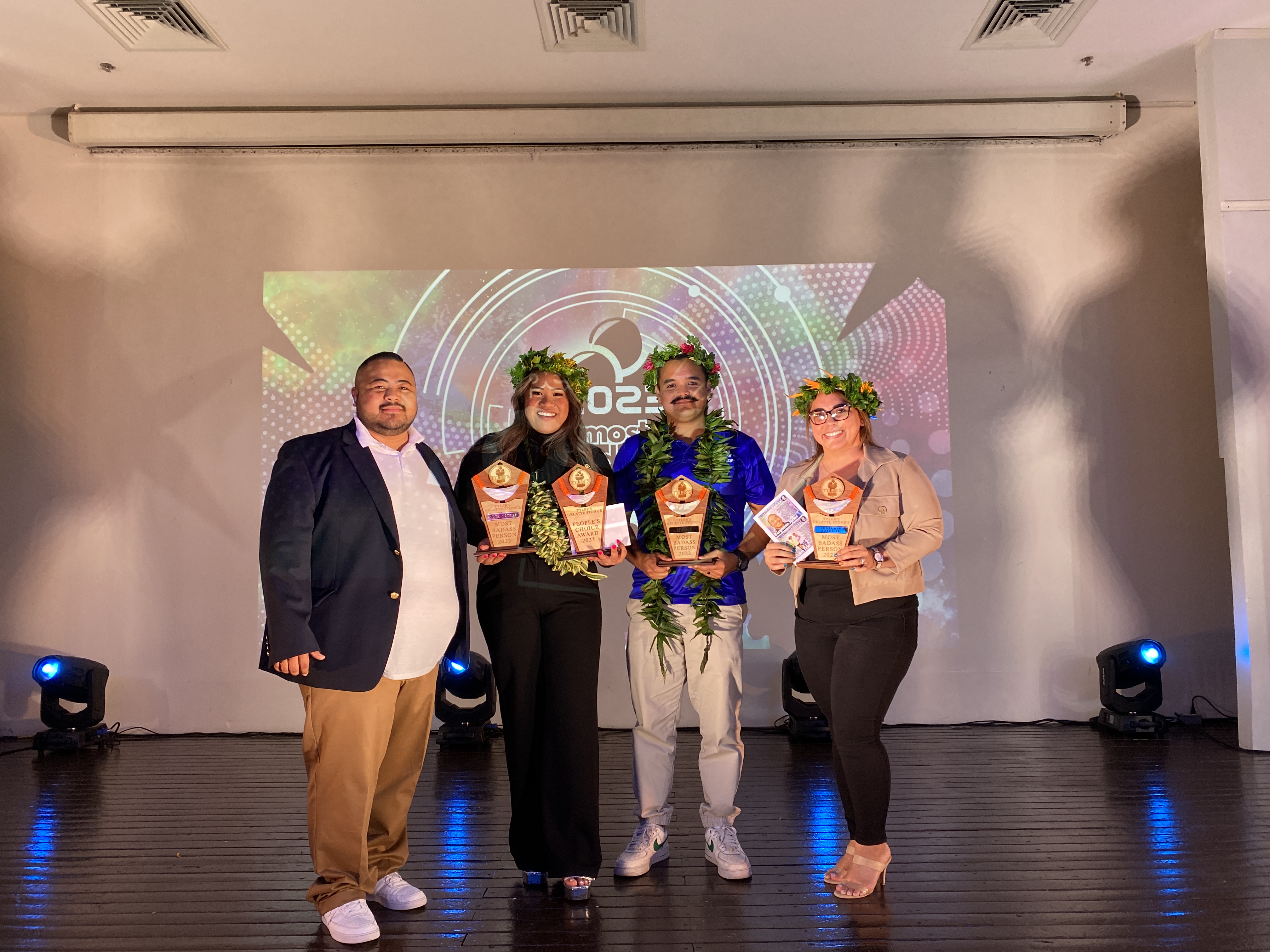 From left, Ben Babauta, Lara Torres, Edward Dela Cruz Jr. and Lenette Jones, accepting the award on behalf of her husband Benjamin Jones, who is off island.